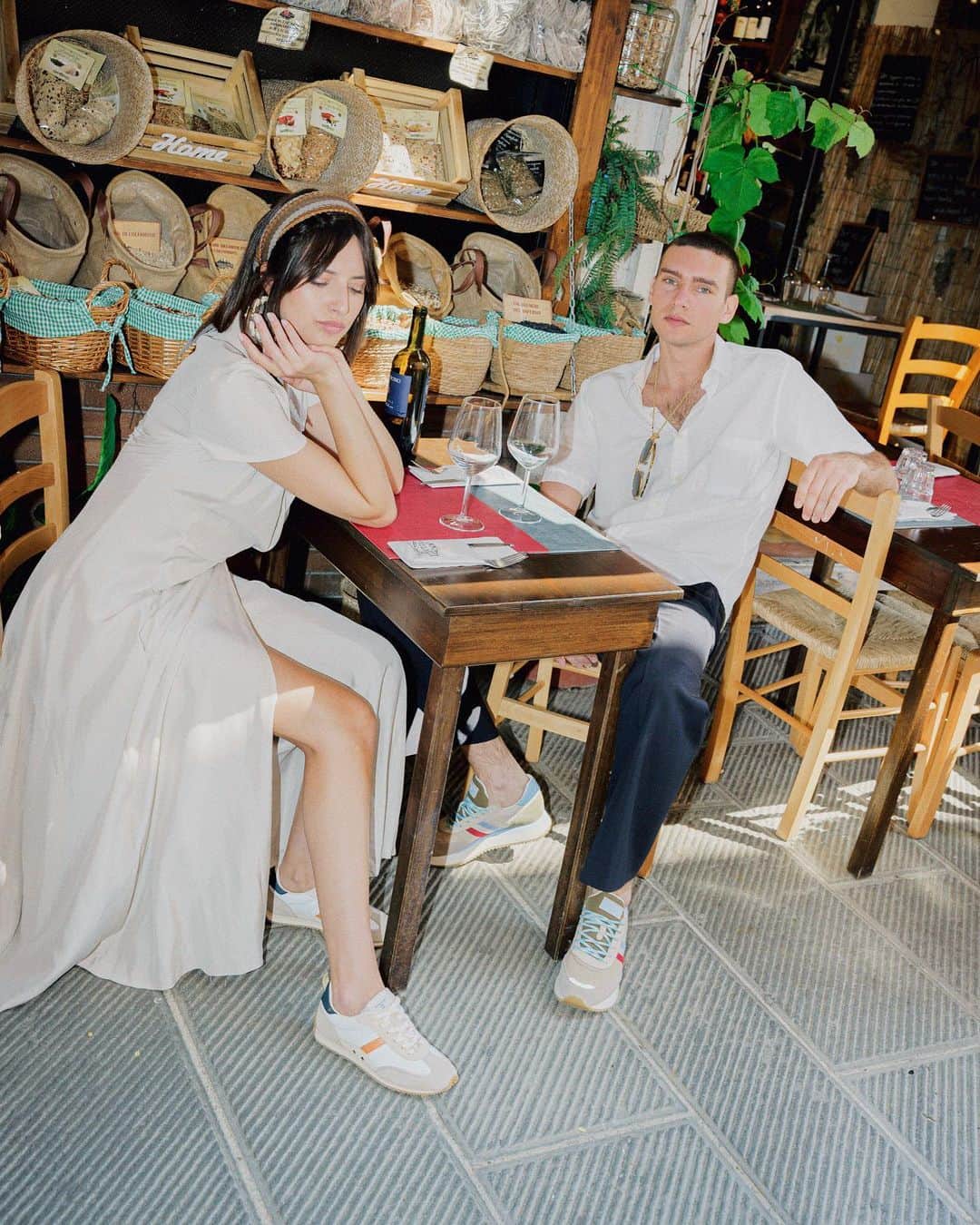 のインスタグラム：「A stop at the village store to enjoy a good glass of vine is all I need right now! 🌈  The vacation continues with our Lady D. And Torino, discover more. #SerafiniShoes  . . . #timeless #italianjourney #italianstyle #shoes #fashion #sneakers #vacation #summervibes  @vineriaterraesole」