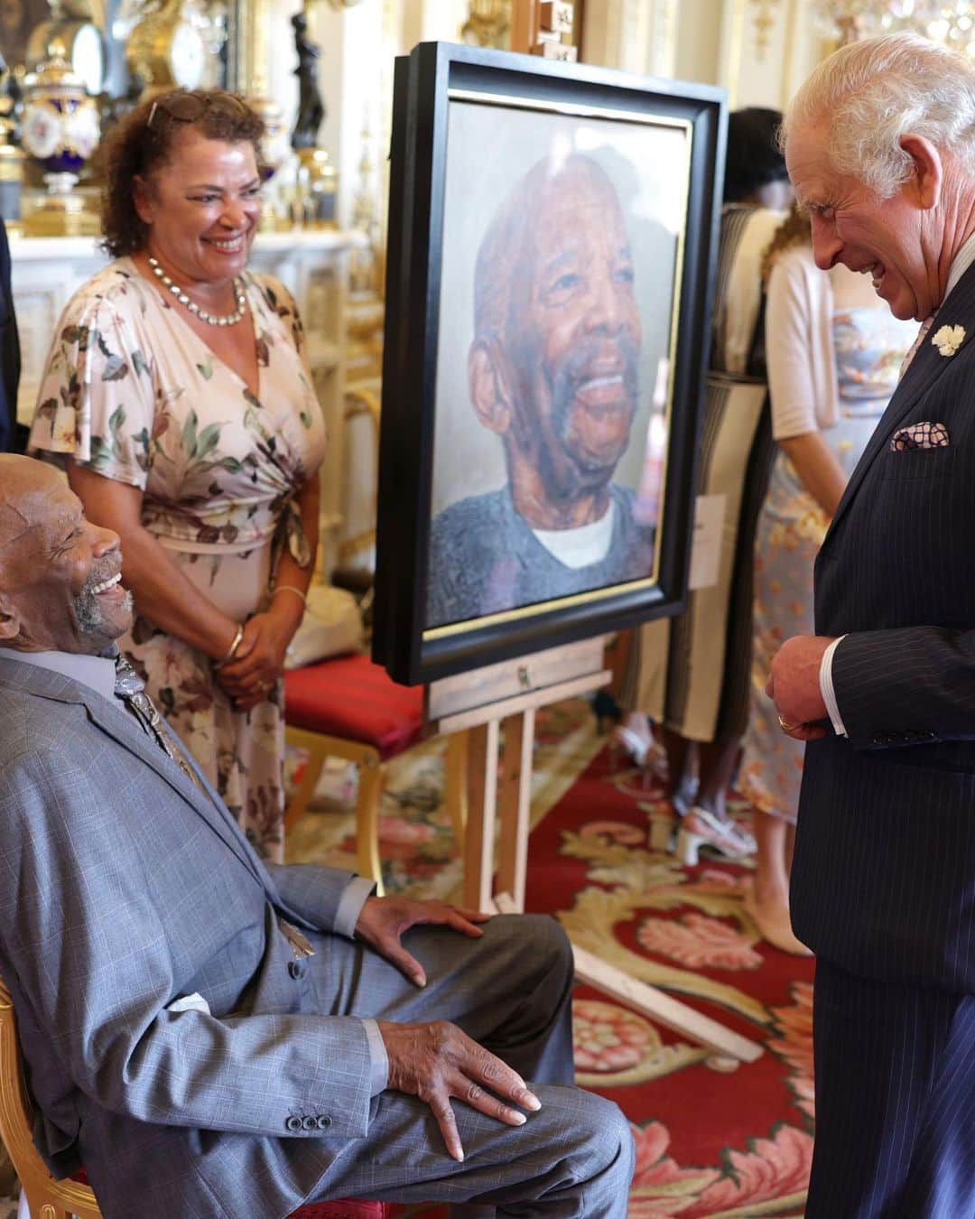 ロイヤル・ファミリーのインスタグラム：「“History is, thankfully and finally, beginning to accord a rightful place to those men and women of the Windrush Generation. The ten portraits of this series, together with the tributes to other members of that indomitable generation, are a small way to honour their remarkable legacy.”  - The King  Last week, Their Majesties unveiled ‘Windrush: Portraits of a Pioneering Generation’ to the sitters and their families during a special reception at Buckingham Palace.  Read more on our website (link in bio).」