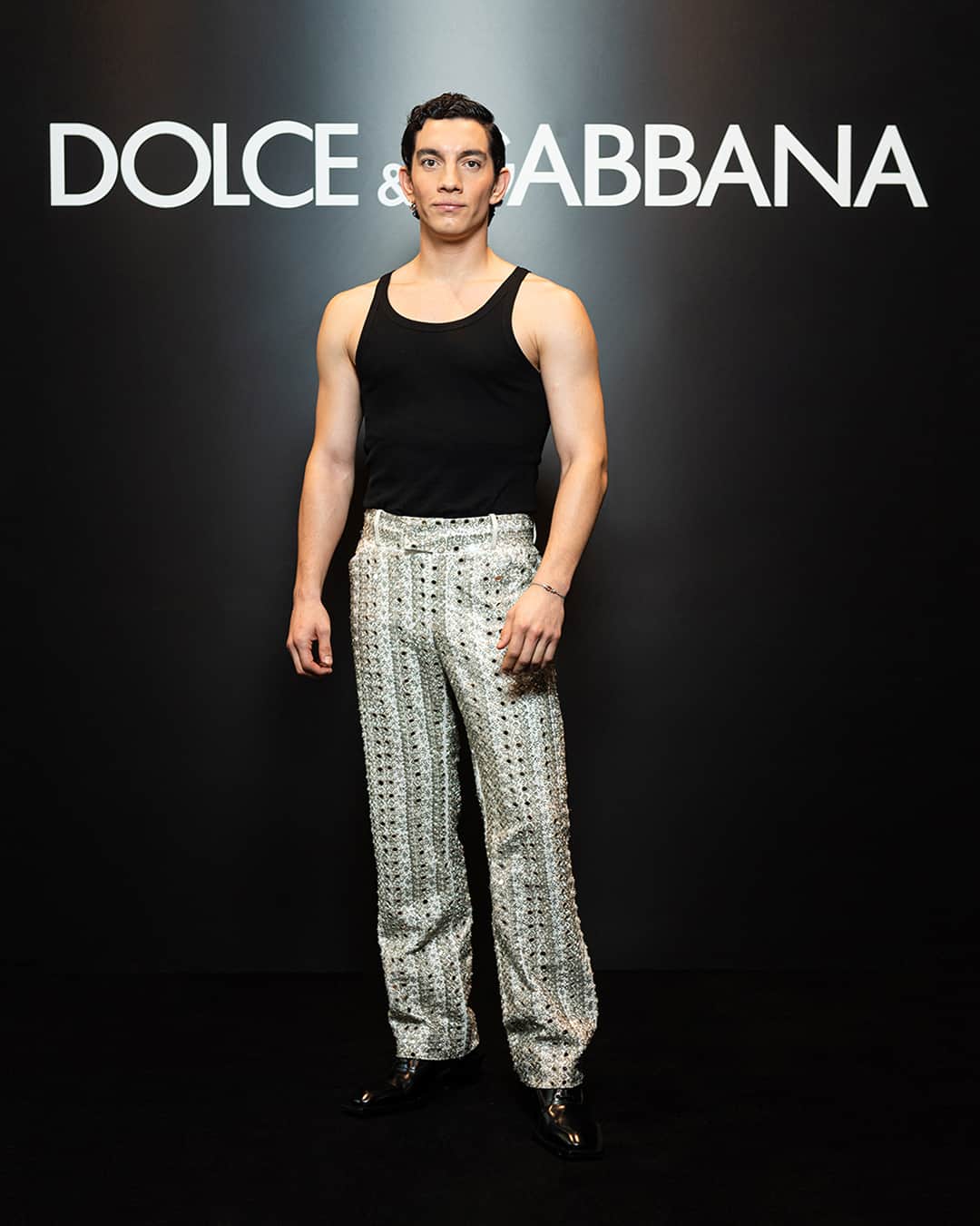 のインスタグラム：「Wearing total #DolceGabbana looks in attendance of the #DGSS24 Men’s Fashion Show “Stile” were @jorgelopez_as, @chay, @peforman and @zecondessa.    Jorge Lopez wore a pair of archival trousers, fully embroidered with mirrors and beads, from the #DGSS17 collection with the “Marcello” ribbed tank top, square toe heeled derby shoes and Swarovski sunglasses.    Chay Suede wore a white lace shirt of the Stromboli collection styled with the “Marcello” ribbed tank top and a pair of wide leg wool trousers, he completed the look with white handmade crochet loafers.    Paul Forman wore a double-breasted, deconstructed linen suit and a “Marcello” ribbed tank top styled with square toe white derby shoes.    José Condessa wore an archival brown corduroy vest along with the double waistband trousers from the Re-Edition series and a pair of ebony boots.    #DGCelebs」