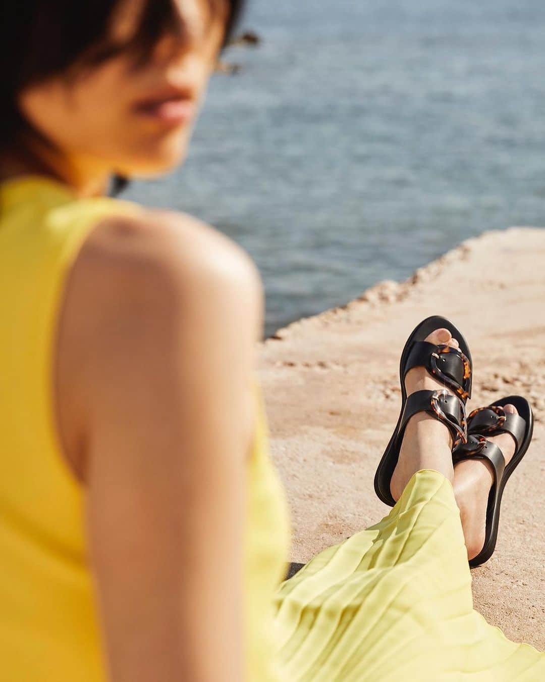 アンシャングリークのインスタグラム：「The ‘Iaso’ sandals are the sleek fashion-forward option for day-to-night city adventures. Two broad straps, each bearing our signature wing buckles, secure the foot - making them perfect for a summer on the go.  #ancientgreeksandals #AGS #Summersandals #handmadeingreece #greece #sandals」