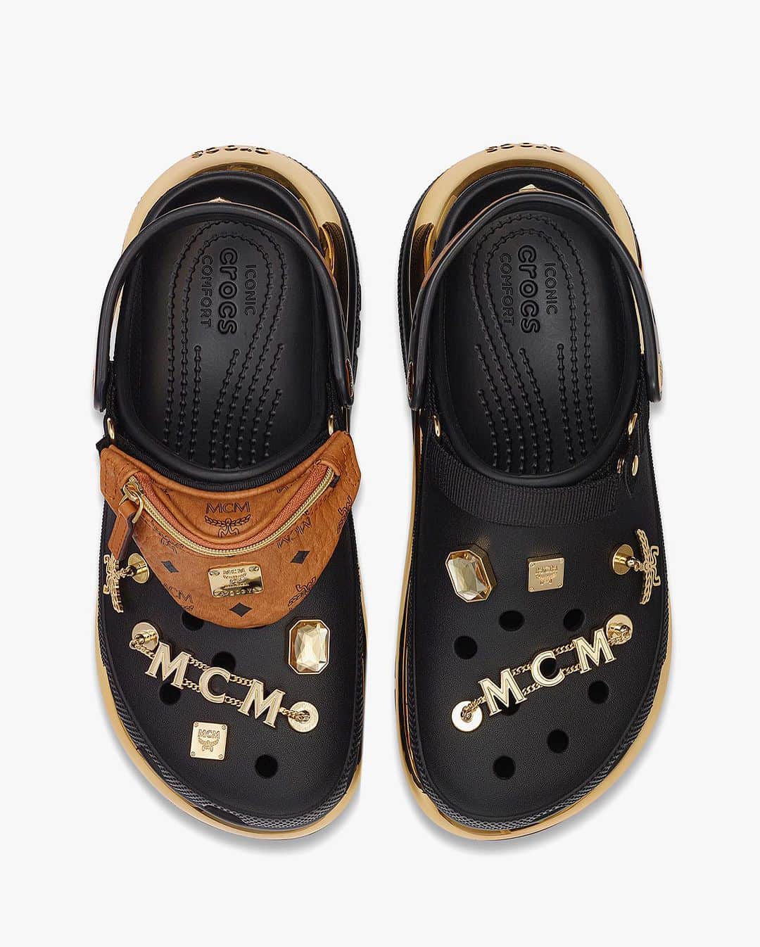 HYPEBEASTさんのインスタグラム写真 - (HYPEBEASTInstagram)「@hypebeastkicks: @crocs has returned to unveil its latest team-up with German luxury label @mcmworldwide and international sensation, @lindsaylohan. ⁠ ⁠ Dubbed the MCM x Crocs Mega Crush Clog, the fresh silhouette meets the world in a campy, virtual-meets-reality campaign that pictures Lohan against the skyscrapers of Dubai.⁠ ⁠ The clogs are made with a unique electrolyzed mirror platform, drawing inspiration from the reflective and progressive nature of modern-day cityscapes. The sole offers an elevated, statement-making platform, while new Jibbitzz™ charms, referencing MCM’s signature house codes, appear all over the design.⁠ ⁠ Notably, the clogs, which are available in “Gold-Black” and “White-Silver” colorways, come with MCM’s quintessential mini-belt bag, which can be attached and detached across the front of each shoe.⁠ ⁠ Pairs are now available to purchase on MCM’s webstore for $450 USD.⁠ Photo: MCM」7月22日 6時04分 - hypebeast