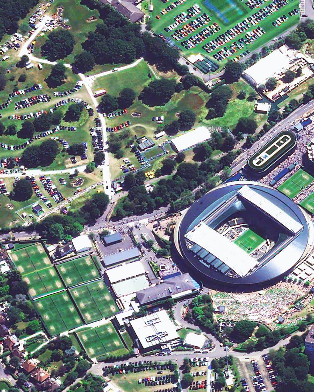 Daily Overviewのインスタグラム：「Wimbledon, the oldest tennis tournament in the world, wrapped up its 136th edition this weekend. The All England Lawn Tennis Club hosts the event on 18 grass courts, the largest of which is Centre Court, accommodating 15,000 spectators. The women’s and men’s singles events this year were won by Markéta Vondroušová and Carlos Alcaraz, respectively.   Created by @benjaminrgrant  Source imagery: @airbus_space」