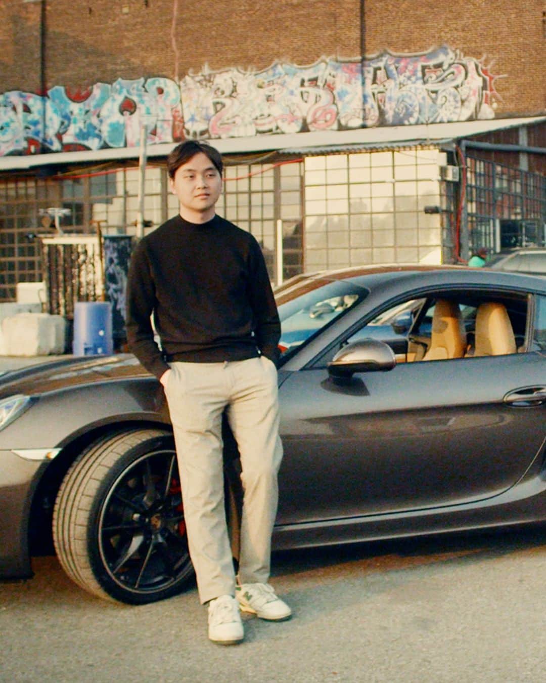 Porscheさんのインスタグラム写真 - (PorscheInstagram)「For colour expert Will Lee, life's too short for monochrome. Don’t miss the full story of Will’s colourful journey. Watch the interview on the link in bio. ___ Born out of a fascination with the rich hues of Porsche cars painted in Paint To Sample colours, @ptsrs is an Instagram page that has grown into a vibrant, inclusive community. At its heart is Will Lee, a colour enthusiast who began boldly curating the striking cars he’d spot around NYC – even though at the time he didn’t own a Porsche himself.   This passion project-turned-digital community brings together those who find their individuality through the artful blend of colour and speed, encouraging self-expression beyond the standard palette.  Today, Will is the proud owner of a Porsche 718 Cayman in Anthracite Brown Metallic. It’s a colour that mirrors his own character. Understated but, in the right light, bursting with life. __ 911 Targa 4: Fuel consumption combined in l/100 km: 10,9 - 10,5 (WLTP); CO2 emissions combined in g/km: 247 - 238 (WLTP) 718 Cayman GT4 RS: Fuel consumption combined in l/100 km: 13,2 (WLTP); CO2 emissions combined in g/km: 299 (WLTP)  Taycan: Electrical consumption combined in kWh/100 km:  23,9 - 19,6 (WLTP); Range combined in km:  371 - 503 (WLTP), Range City in km:  440 - 566 (WLTP); CO2 emissions combined in g/km: 0 (WLTP) I https://porsche.click/DAT-Leitfaden I Status: 07/2023」7月21日 18時06分 - porsche