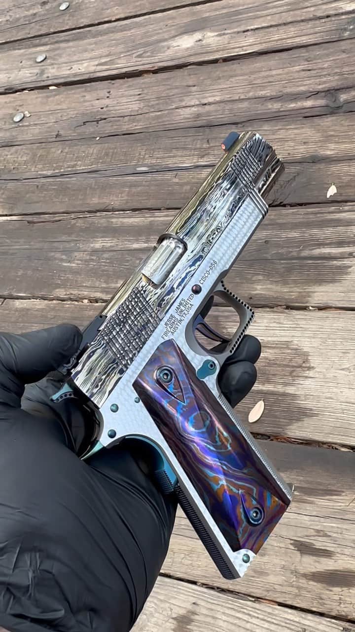 ウエストコーストチョッパーズのインスタグラム：「Wooo!🥵  JJFU Damascus “CISCO” 1911  1026 Layer Damascus slide forged by @popeofwelding  *This is an “End of the Day” Damascus billet combining all the scraps and drops over the last year. Making a beautifully random Damascus slide with an over abundance of character and action.  416 Stainless Steel frame in two tone Matte and Pelage finishes.  JJFU Stainless Steel TearDropped bushing barrel chambered in 45acp in Perlage finish.  JJFU ultra thin grip panels made from Tri-Color Titanium Damascus.  JJFU Race-Spur hammer and JJFU Fang Trigger.  All pins and levers finished in JJFU Electric Blue.  Low cut Dawson Bomar style adjustable rear sight with a Hi Viz Trijicon front sight.  Packaged up in a JJFU handmade Black Walnut presentation box.  All proudly made in Austin Texas USA🇺🇸  888-269-0666   Guns@jessejames.com   www.JJFU.com」