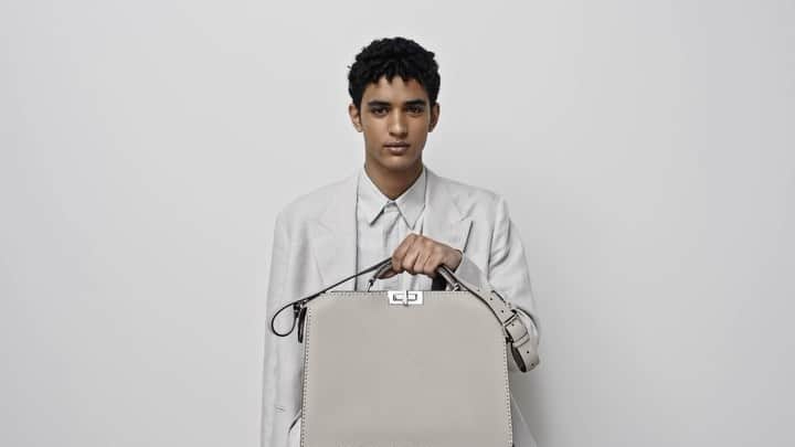 Fendiのインスタグラム：「Timeless staples with a Fendi twist. The iconic #FendiPeekaboo is paired with a playful summer suiting silhouette and Fendi moccasins for #FendiSummer.  Artistic Director of Accessories and Menswear: @silviaventurinifendi ​ Artistic Director of Jewelry: @delfinadelettrez​  Video: @walestudioroma   Styling: @ganio Makeup: @samiamohsein Hair: @ramoneyluv  Casting: @piergiorgio  Models: Abas Abdirazaq, Nathaniel Ortiz」