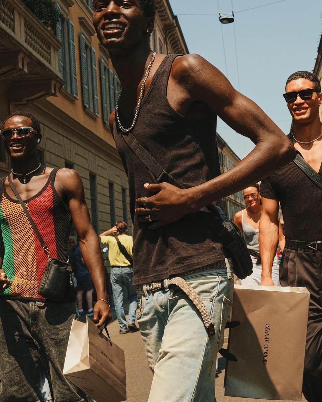 New York Times Fashionさんのインスタグラム写真 - (New York Times FashionInstagram)「Outside the men’s wear shows in Milan and Paris this month, fashion insiders showed up in inventive looks that included three-piece suits and graphic tees. Pharrell Williams, the new Louis Vuitton men’s creative director, wore a Kenzo jacket-and-shorts set.  The photographer @simbarashecha spent 10 days observing the fashion on the streets of Milan and Paris, where neck scarves were a potent accessory and the few who had traditional neckties wore them atypically, including with collarless shirts.  “It’s not a stretch to say that men’s wear has long been seen by many as simpler and less creative than women’s wear,” he writes. “But as more men have found ways to personalize even the most traditional staples, they have shown that there are far wider possibilities than once thought.”  Others on the street revived a fad popularized in the early 1990s by the hip-hop duo Kriss Kross: wearing blazers and shirts in reverse, so the buttons and lapels were on the back. And there were various graphic tops with popular culture references, including a fisherman’s sweater with an image of Kurt Cobain’s face and a sleeveless tunic featuring the album cover of “Substance” by New Order.  See more style outside from recent fashion weeks at the link in bio. Photos by @simbarashecha」6月29日 1時42分 - nytstyle