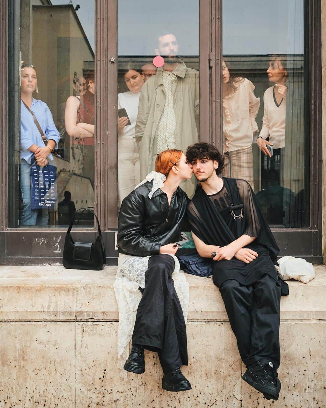 New York Times Fashionさんのインスタグラム写真 - (New York Times FashionInstagram)「Outside the men’s wear shows in Milan and Paris this month, fashion insiders showed up in inventive looks that included three-piece suits and graphic tees. Pharrell Williams, the new Louis Vuitton men’s creative director, wore a Kenzo jacket-and-shorts set.  The photographer @simbarashecha spent 10 days observing the fashion on the streets of Milan and Paris, where neck scarves were a potent accessory and the few who had traditional neckties wore them atypically, including with collarless shirts.  “It’s not a stretch to say that men’s wear has long been seen by many as simpler and less creative than women’s wear,” he writes. “But as more men have found ways to personalize even the most traditional staples, they have shown that there are far wider possibilities than once thought.”  Others on the street revived a fad popularized in the early 1990s by the hip-hop duo Kriss Kross: wearing blazers and shirts in reverse, so the buttons and lapels were on the back. And there were various graphic tops with popular culture references, including a fisherman’s sweater with an image of Kurt Cobain’s face and a sleeveless tunic featuring the album cover of “Substance” by New Order.  See more style outside from recent fashion weeks at the link in bio. Photos by @simbarashecha」6月29日 1時42分 - nytstyle