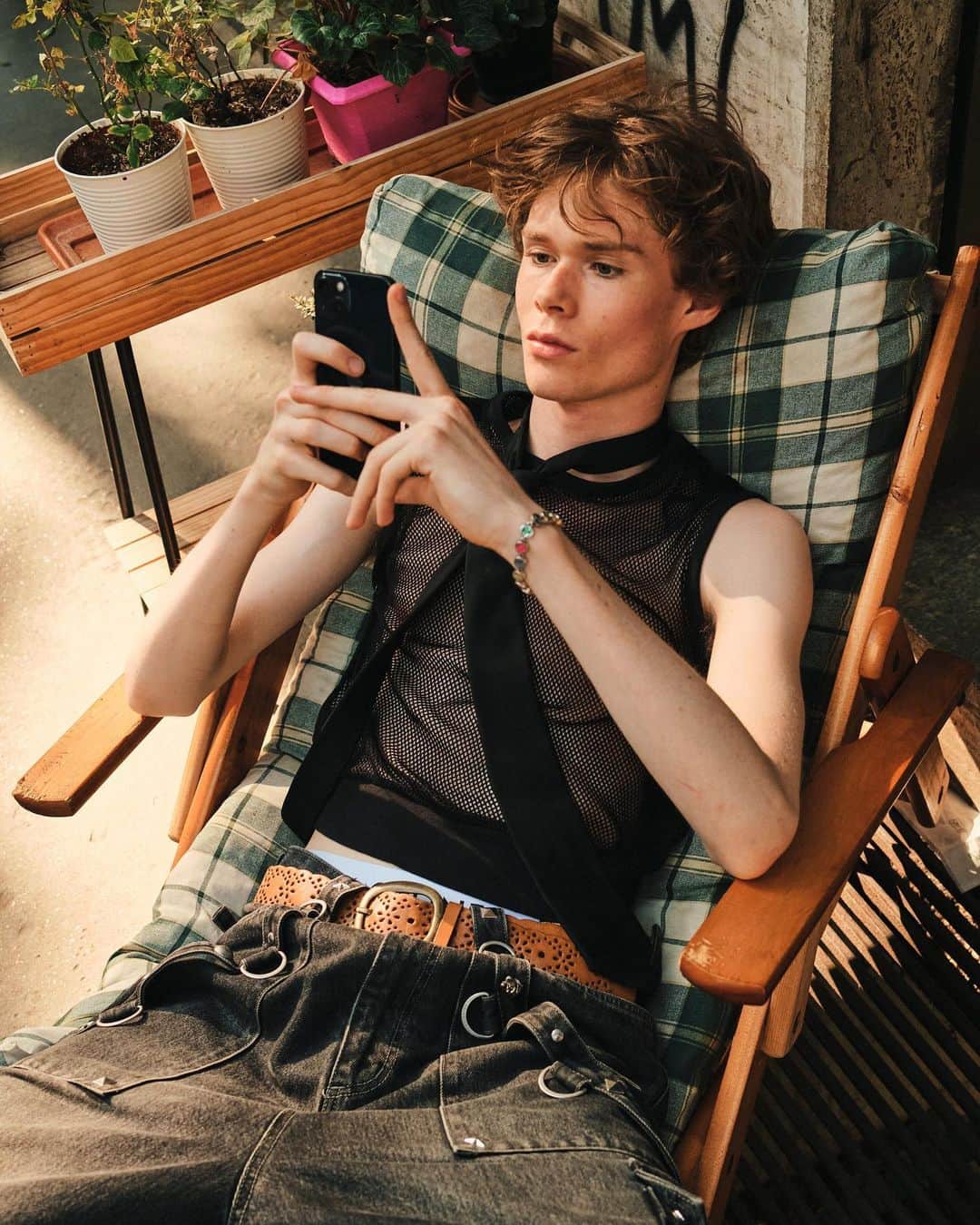 New York Times Fashionさんのインスタグラム写真 - (New York Times FashionInstagram)「Outside the men’s wear shows in Milan and Paris this month, fashion insiders showed up in inventive looks that included three-piece suits and graphic tees. Pharrell Williams, the new Louis Vuitton men’s creative director, wore a Kenzo jacket-and-shorts set.  The photographer @simbarashecha spent 10 days observing the fashion on the streets of Milan and Paris, where neck scarves were a potent accessory and the few who had traditional neckties wore them atypically, including with collarless shirts.  “It’s not a stretch to say that men’s wear has long been seen by many as simpler and less creative than women’s wear,” he writes. “But as more men have found ways to personalize even the most traditional staples, they have shown that there are far wider possibilities than once thought.”  Others on the street revived a fad popularized in the early 1990s by the hip-hop duo Kriss Kross: wearing blazers and shirts in reverse, so the buttons and lapels were on the back. And there were various graphic tops with popular culture references, including a fisherman’s sweater with an image of Kurt Cobain’s face and a sleeveless tunic featuring the album cover of “Substance” by New Order.  See more style outside from recent fashion weeks at the link in bio. Photos by @simbarashecha」6月29日 1時42分 - nytstyle