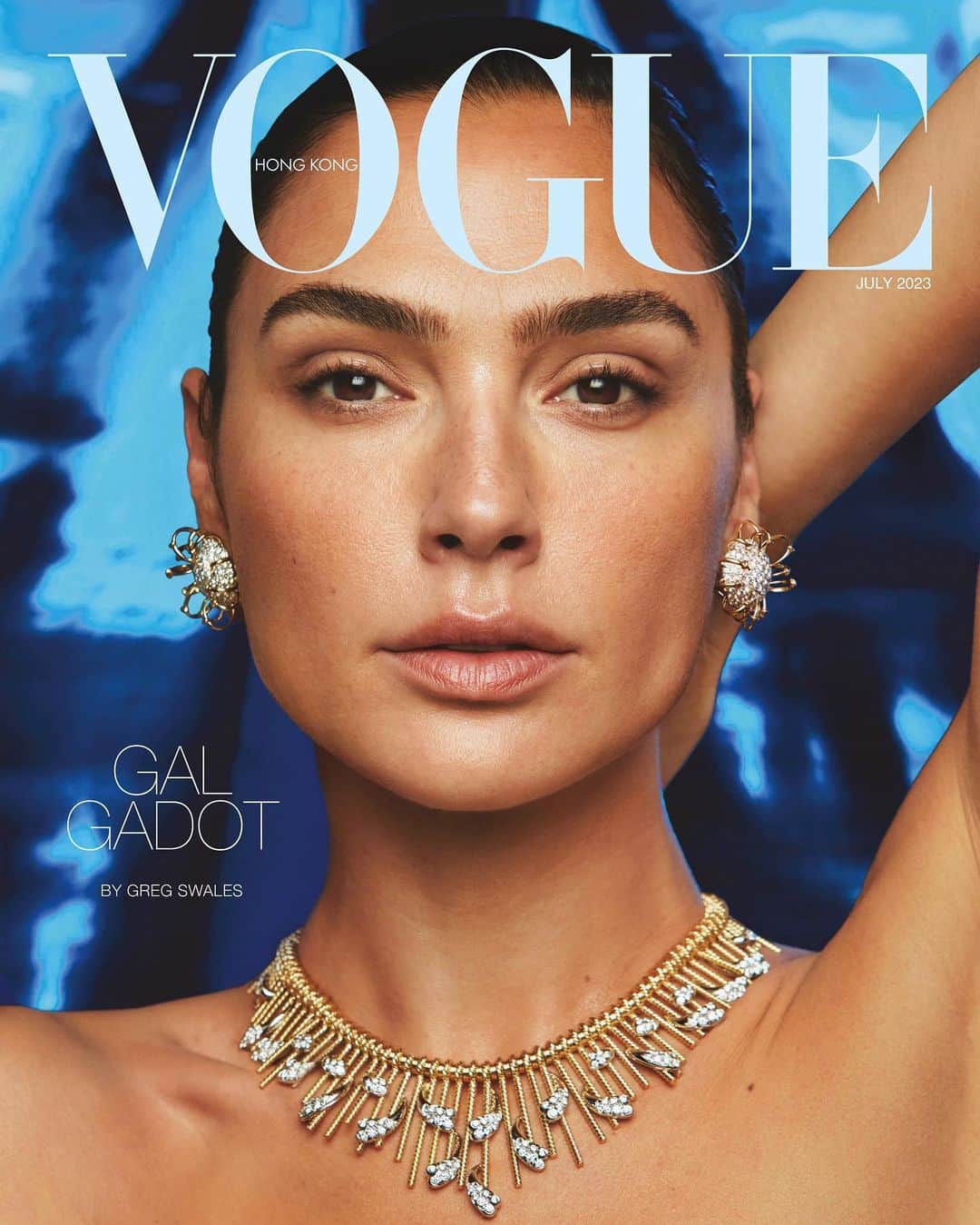ガル・ガドットのインスタグラム：「Thank you for having me @VogueHongKong 💙  Photographer: @GregSwalesArt - YOU ROCK!  Stylist: @KarlaWelchStylist Cover Wardrobe: @YSL by @anthonyvaccarello  Cover Jewelry: @TiffanyAndCo Makeup Artist: @MissJoBaker Hair Stylist: @JennyChoHair Manicurist: @NailsByShige Producer: @AlexeyG @agpnyc  Casting: @jilldemling」