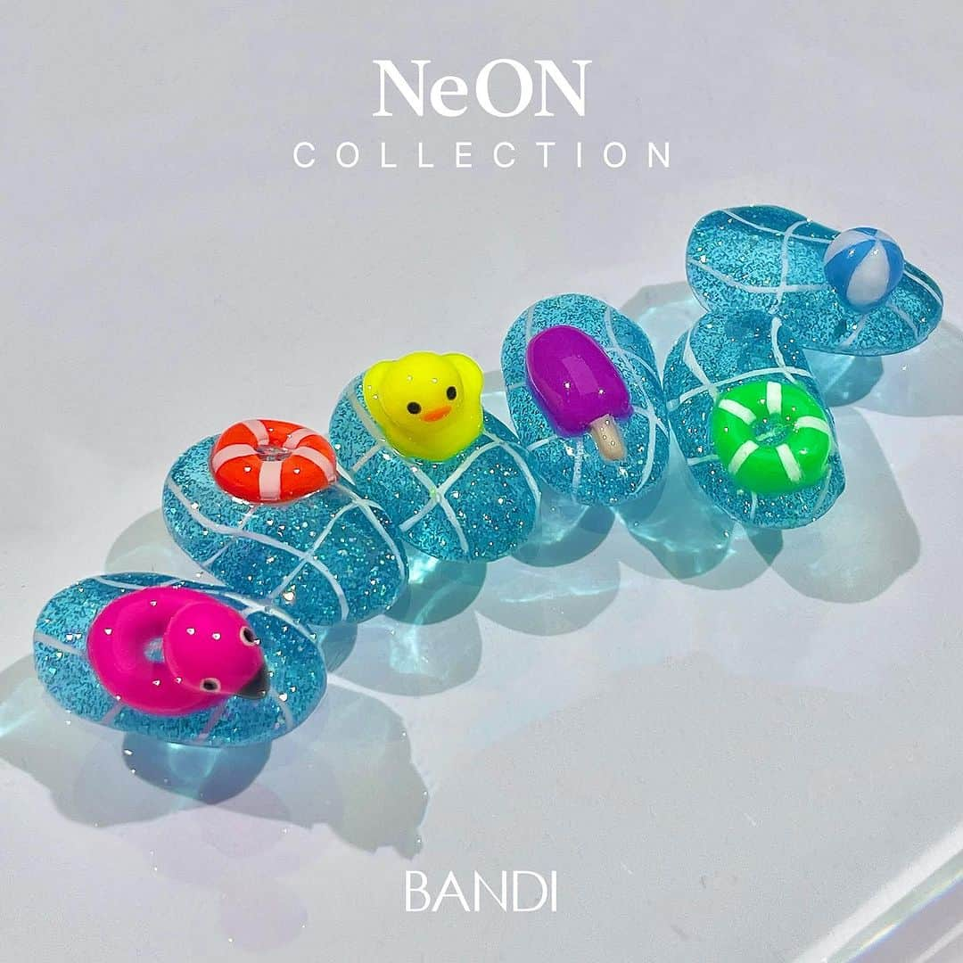 반디네일さんのインスタグラム写真 - (반디네일Instagram)「⠀  NeON & Neon POP 으로 어두운곳에서도 화려하게 빛나는 여름 아트 완성 🌊🌈 ⠀ ⠀ 𝗡𝗲𝗼𝗻 𝗣𝗢𝗣🌈 한눈에 시선을 잡아 끄는 사랑스럽고 생동감 있는 네온 컬러 6종   𝗡𝗲 𝗢𝗡 ⚡️ 걸리시하면서도 키치함이 느껴지는  시럽 네온 반사 글리터 6종 출시 ✨ ⠀ ⠀ ⠀ ⠀ ⠀ 👉🏻구매처: 반디 본사(02-3443-8009) 및 전국 지사 👉🏻반디의 모든 이미지는 사용 시 출처를 밝혀주세요. ⠀ ⠀ ⠀ ⠀ #bandi #bandigel #colorobjet #반디젤  #반디 #반디네일 #네일아트 #젤네일 #젤네일아트 #여름신상컬러 #여름컬렉션 #여름네일 #반디신상 #형광네일아트 #형광네일 #형광젤 #네온컬러 #네온네일 #반사글리터 #반사젤 #반사네일  #반디네온 #반디네온팝  #글리터네일 #여름네일아트 #오리네일 #바다네일 #수영장네일 #튜브네일 #엠보네일」6月30日 11時58分 - bandinail_official