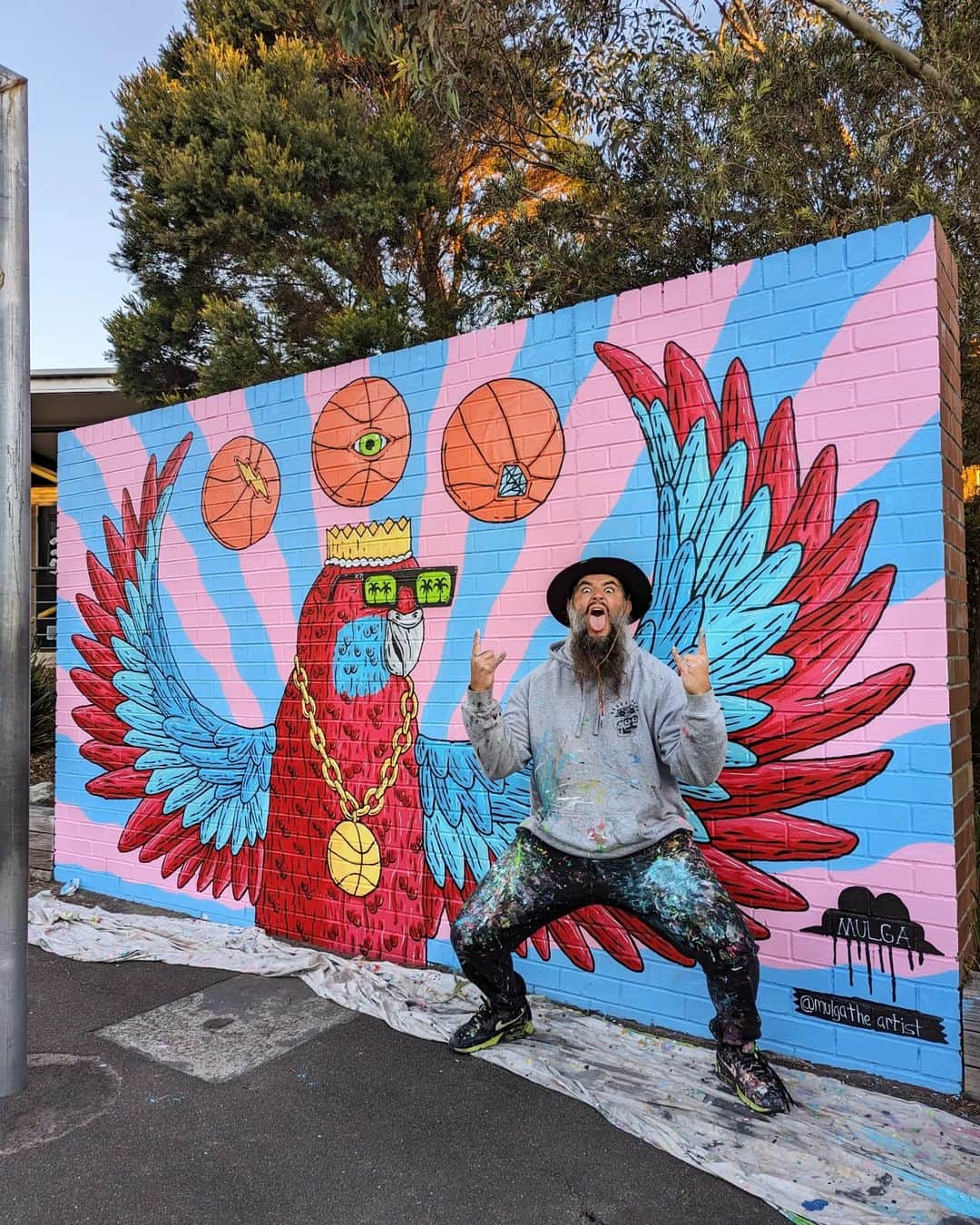 MULGAさんのインスタグラム写真 - (MULGAInstagram)「Fun times painting a B-ball Rosella mural over 2 days at Lucas Heights Community School last week.⁣ ⁣ I did a celebratory dunk after I finished*.⁣ ⁣ The story of Randy the Rosella ⁣ ⁣ Once there was a Rosella called Randy and  he enjoyed playing basketball immensely and was actually pretty good at it. ⁣ ⁣ He rose to the pinnacle of the ABL (Aviary Basketball League) and won a few championships before a big scandal erupted and he was given a life ban from playing in ABL. ⁣ ⁣ The reason he was banned was because it was discovered that he was using his magical telekinetic powers to control the basketball in games. Basically whenever he took a shot he was able to telekinetically cause the ball to always go in the hoop. ⁣ ⁣ He didn't always have those powers and he only got them one day when he was rummaging around at his local dump and ate a radioactive gummy worm that he found. ⁣ ⁣ Anyhow, after he was banned he developed and toured a show around the country where he did heaps of cool telekinetic tricks and stuff. It was mad popular and kept him busy for years. ⁣ ⁣ The End ⁣ ⁣ *Not true.⁣ ⁣ #mulgatheartist #art #artistsoninstagram #artoftheday #artwork #artofinstagram #australianart #australianartist #artistic #muralartist #muralart #mural #muralist #artworking #painting #schoolmural #rosella #basketballart #rosellapainting」7月1日 17時23分 - mulgatheartist