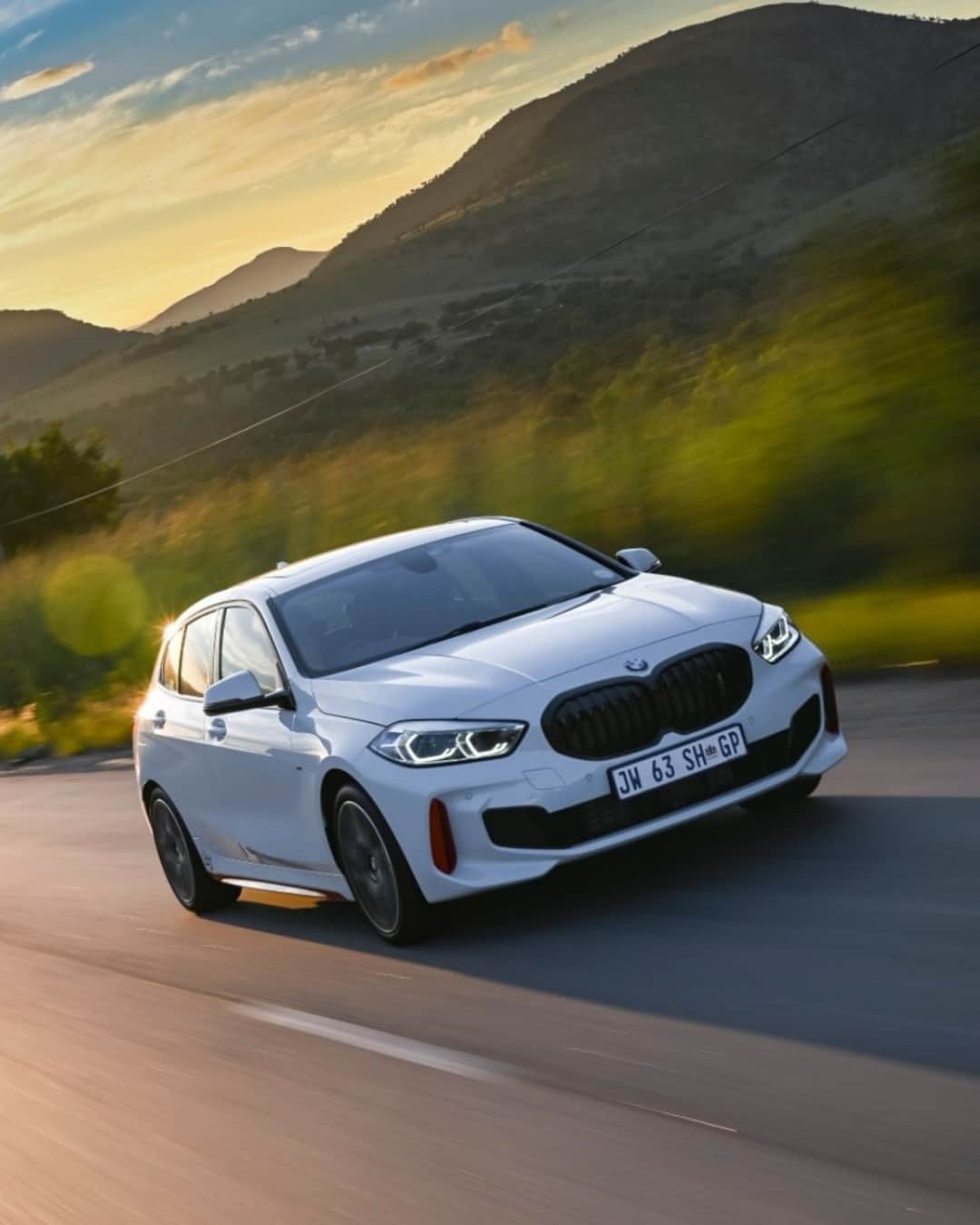BMWのインスタグラム：「Gliding down a road called JOY 😎  The BMW 1 Series.  #THE1 #BMW #1Series  __ BMW 128ti: Combined fuel consumption: 7.4–6.8 l/100 km. Combined CO2 emissions: 170–156 g/km. All data according to WLTP. Further info: www.bmw.com/disclaimer」