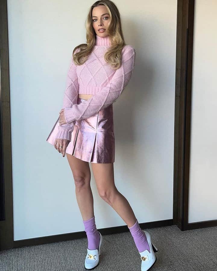 Vogueさんのインスタグラム写真 - (VogueInstagram)「#MargotRobbie has been leaning into the "method dressing" trend during the press tour for her hotly anticipated #Barbie movie, taking cues from her Mattel doll character's famous looks and some real-life runway Barbies of the '90s. On the Sydney stop of the Barbie promo tour, the actor sported a pink @versace turtleneck jumper and matching metallic miniskirt that #KateMoss. Tap the link in our bio for all the details on the star's looks for the Barbie movie.」7月3日 3時01分 - voguemagazine