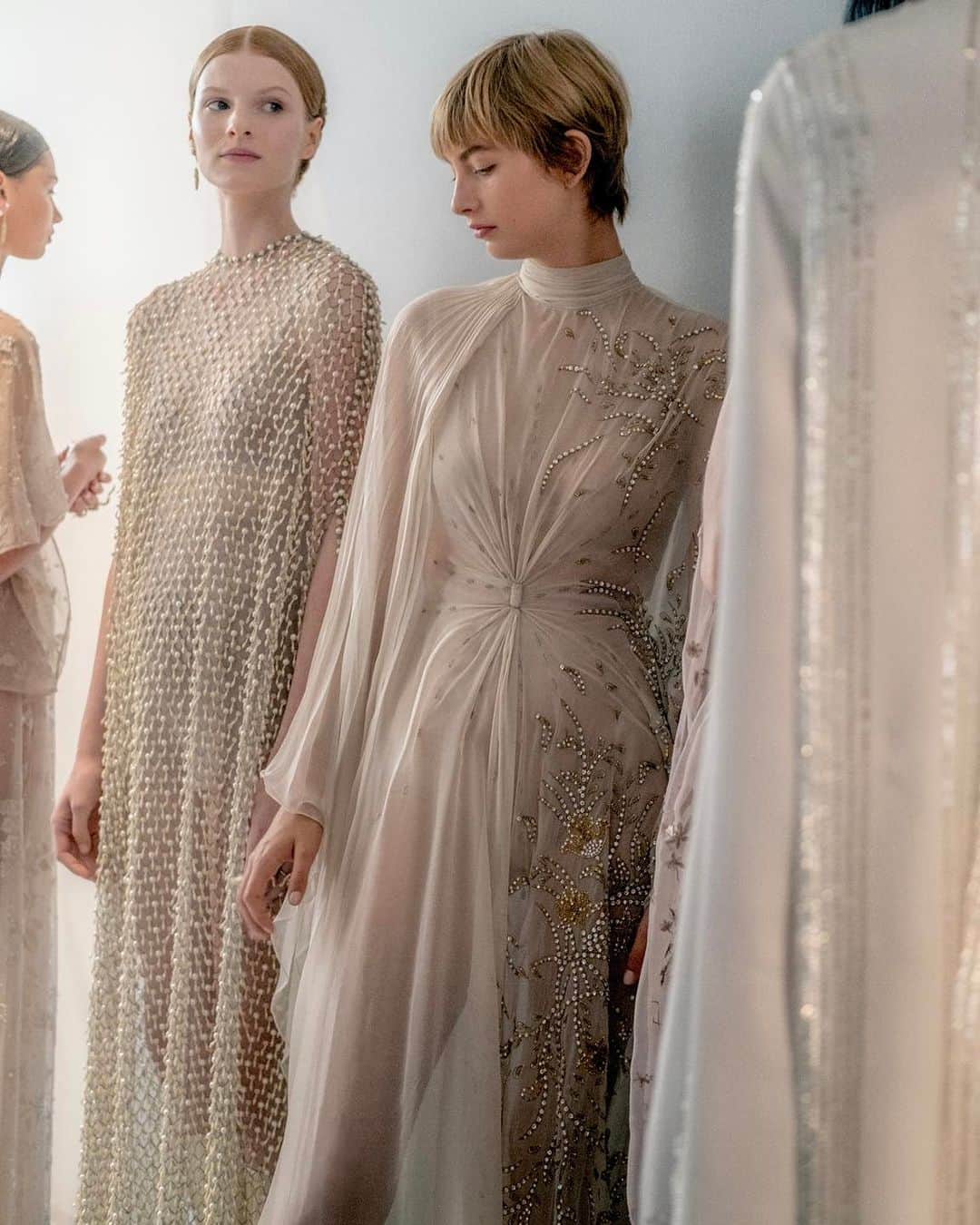 のインスタグラム：「A visit backstage before the #DiorCouture Autumn-Winter 2023-2024 show illuminates the low-key palette of these high-impact pieces by @MariaGraziaChiuri. Looking anew at Greco-Roman antiquity and translating into today, via the House's own history and fabled #DiorSavoirFaire, delicately tonal embroideries brought an elevated gracefulness to eveningwear, pleat effects were delineated by grosgrain ribbons or soft gathers alike, the iconic @DiorBarJacket glistened subtly in textured metallic weaves. © MelieHirtz」