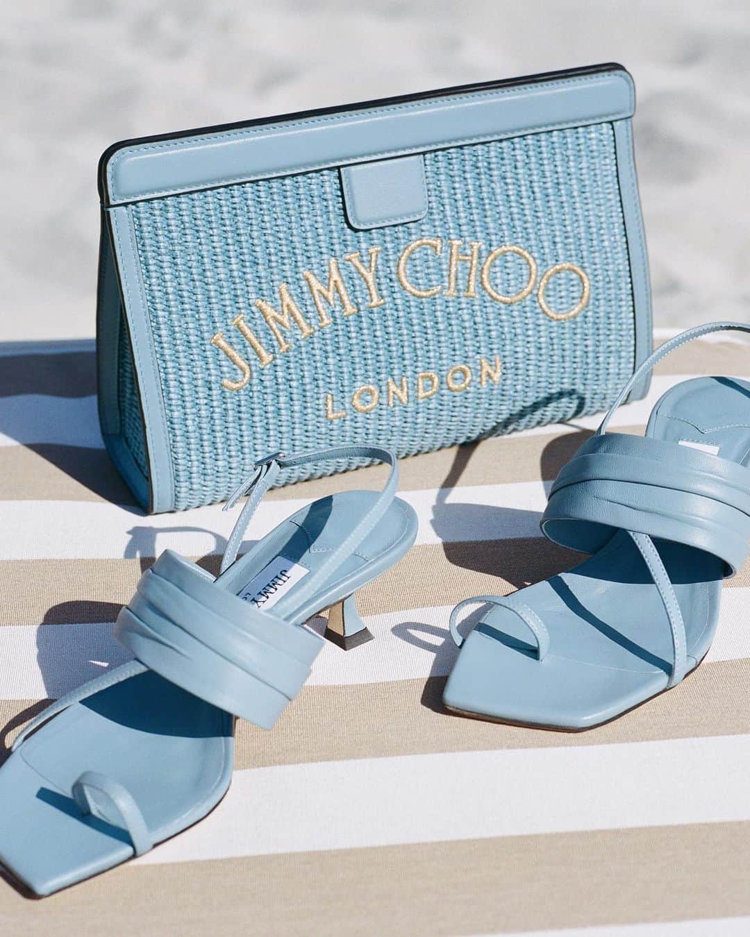 Jimmy Chooさんのインスタグラム写真 - (Jimmy ChooInstagram)「Dress for the weather you want - channel blue skies with our barely-there Beziers sandals and Avenue Pouch.   #JimmyChoo」7月7日 0時59分 - jimmychoo