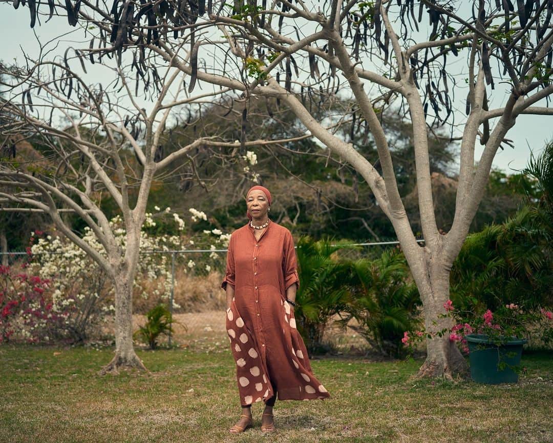 TIME Magazineのインスタグラム：「Esther Phillips is Barbados' first poet laureate. For years, she dismissed reparations as radical—but now she's an unwavering supporter.  When we reach the dirt road leading to Drax Hall plantation, writes Janell Ross in TIME's most recent cover story, Phillips suggests we stop the car. She gets out and draws in a deep breath.  Drax Hall, a Barbados sugar plantation, was the site of untold horrors. It now belongs to Richard Drax, a Conservative member of the British Parliament.  In July 2021, Phillips published an open letter in Barbados Today under the headline pay up, mr. drax. Phillips had read an article in which Richard Drax said slavery was regrettable but he didn't see himself as culpable.  "This man has profited and still profits by the largesse, the wealth, all that was poured out for him through the sacrifice of my ancestors. And the only thing he can find to say is it is 'regrettable'?" Phillips says.  "I personally want nothing from Richard Drax. But if I were Richard Drax, I would be so glad to get rid of that [Drax Hall]. I would say let me give it up to show that I have some kind of feeling for the horrors, for the people who were brutalized."  Read more on Barbados' fight for reparations at the link in our bio. Photograph by Christopher Gregory-Rivera (@cgregoryphoto) for TIME」