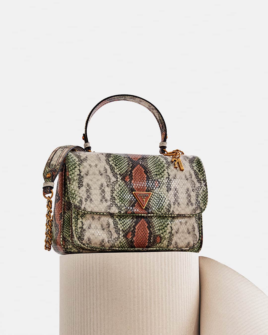 ゲスのインスタグラム：「The Becci Mini Convertible Bag features a faux-leather python print and antique bronze-tone hardware. #GUESSHandbags」