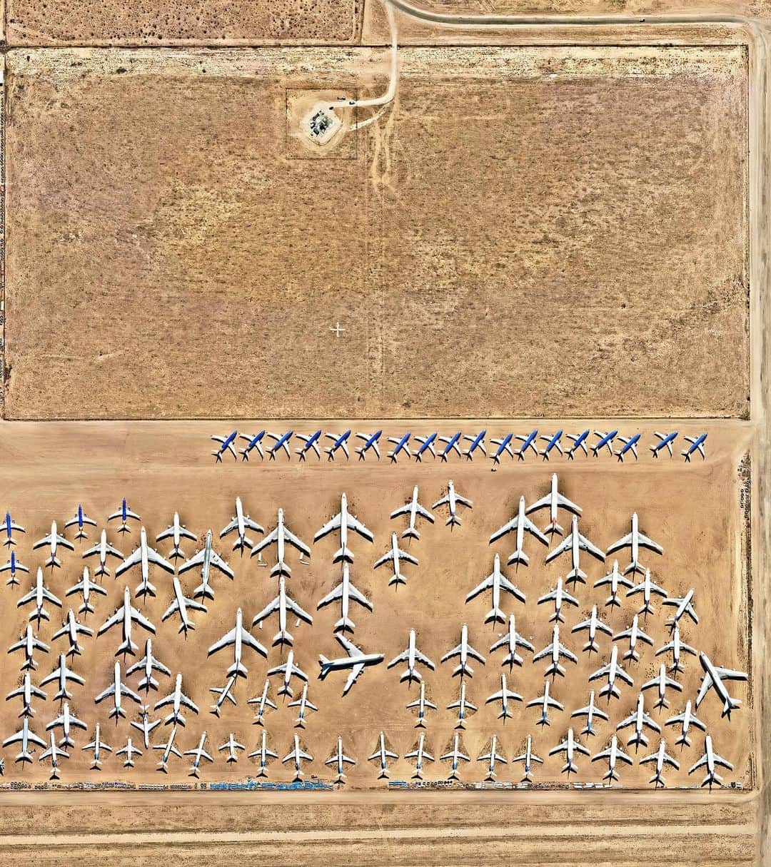 Daily Overviewさんのインスタグラム写真 - (Daily OverviewInstagram)「Swipe to see the Southern California Logistics Airport in Victorville, California, which contains an aircraft boneyard with more than 150 retired planes. Because the demand for jumbo jets has dropped significantly in the last two decades in favor of smaller, more affordable twin-engine planes, many large aircrafts such as Boeing 747s have been retired. The dry conditions in Victorville – located on the edge of the Mojave Desert – limits the corrosion of metal, meaning planes can be stored here for years while they are stripped for spare parts.  Created by @benjaminrgrant  Source imagery @nearmap」7月7日 6時06分 - dailyoverview