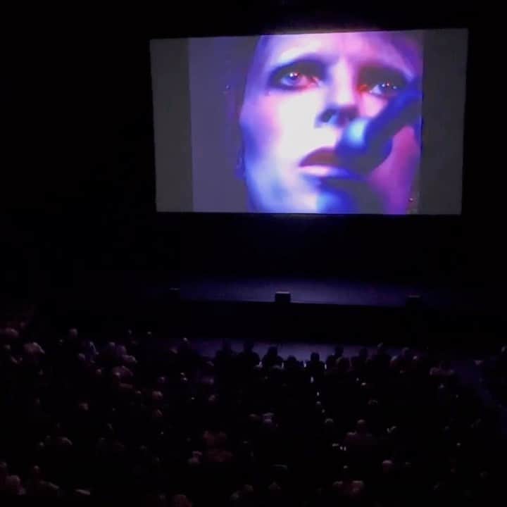 イマン・アブドゥルマジドのインスタグラム：「#rp @davidbowie THANK YOU HAMMERSMITH  “Me, me, me, me, me… ”  For those of you who were at the 50th anniversary screening at the Hammersmith Odeon (now the @EventimApollo) or at a cinema last night, we think you’ll agree it was emotional.  There were many notable moments, but it was wonderful that so many joined in at the end of My Death, as captured in our little snippet. Did you witness the same wherever you saw it?  Mike Garson’s piano medley earned him a standing ovation before the film and there were also some interesting musings from the Q&A panel.  If you didn’t manage to get to any of last night’s screenings, there’s another chance to see it in UK and selected European cinemas on 6th July. Find participating cinemas at www.davidbowie.com/ziggy  Link in bio  #Ziggy50 #BowieHammersmithOdeon50th #ZiggyMoPi」