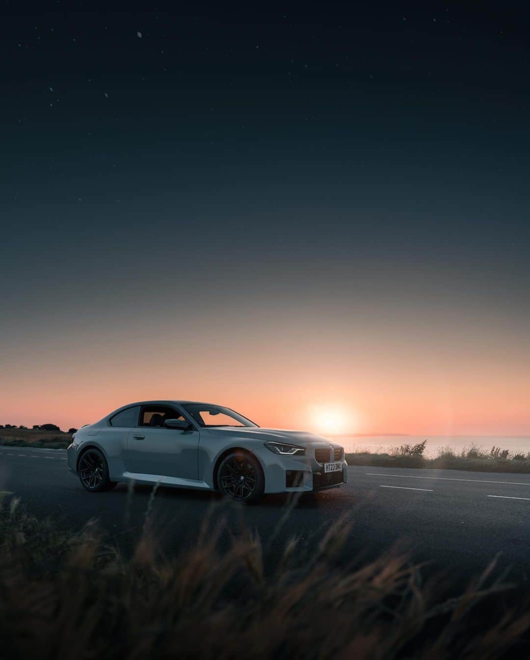 BMWのインスタグラム：「The stars made my night, the drive made it bright.  📸: @georgecolbeanu #BMWRepost   The BMW M2. #THEM2 #BMWM #M2 #BMW __ BMW M2: Combined fuel consumption: 10.2–9.6 l/100 km. Combined CO2 emissions: 231–218 g/km. All data according to WLTP. Further info: www.bmw.com/disclaimer」