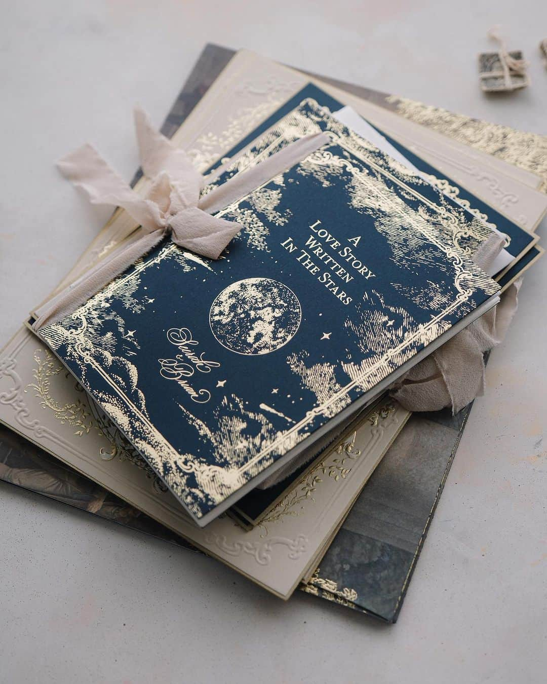 Veronica Halimさんのインスタグラム写真 - (Veronica HalimInstagram)「A love story written in the stars: An invitation suite designed and crafted exclusively for Seirah and Brian for their special day. It's going to be three days celebration filled with joy, love, and endless memories. —  #stars #lovewritteninthestars #truffypi  #カリグラフィースタイリング  #weddinginvitation #weddingstationery  #embossed  #paperlovers #ウェディング #ウェディングアイテム #カリグラファ #veronicahalim #スタイリング #prettypapers #weddingsuite #washingtondc #washingtonnationalcathedral」7月9日 13時37分 - truffypi