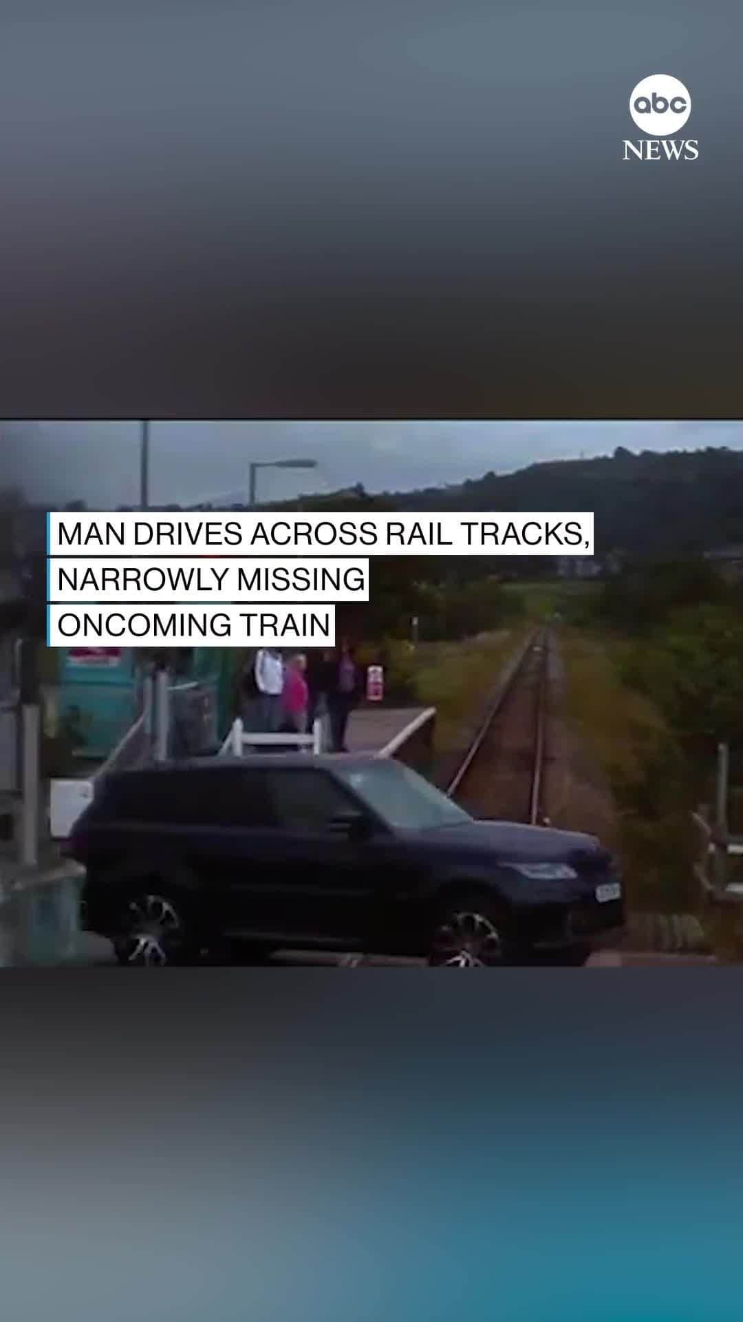 ABC Newsのインスタグラム：「MOMENT OF MADNESS: Surveillance footage shows shocking near miss as man drives across rail tracks right in front of an oncoming train. #train #cars #driving #closecall #uk #travel #transport」