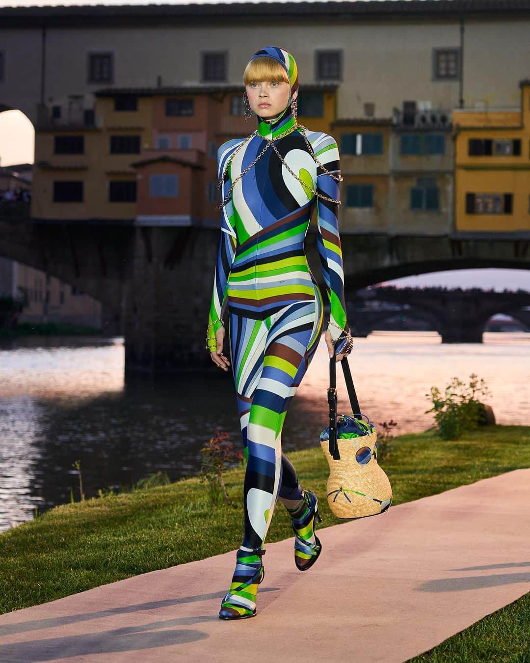 エミリオプッチのインスタグラム：「Total Pucci by the Ponte Vecchio. The historic bridge of Florence played backdrop to the colourful catsuits by @camillemiceli, which appeared as the finale of the Initial E.P. runway show in May.   Now available in stores and online. Make them yours.  #PucciCatsuits #InitialsEP」