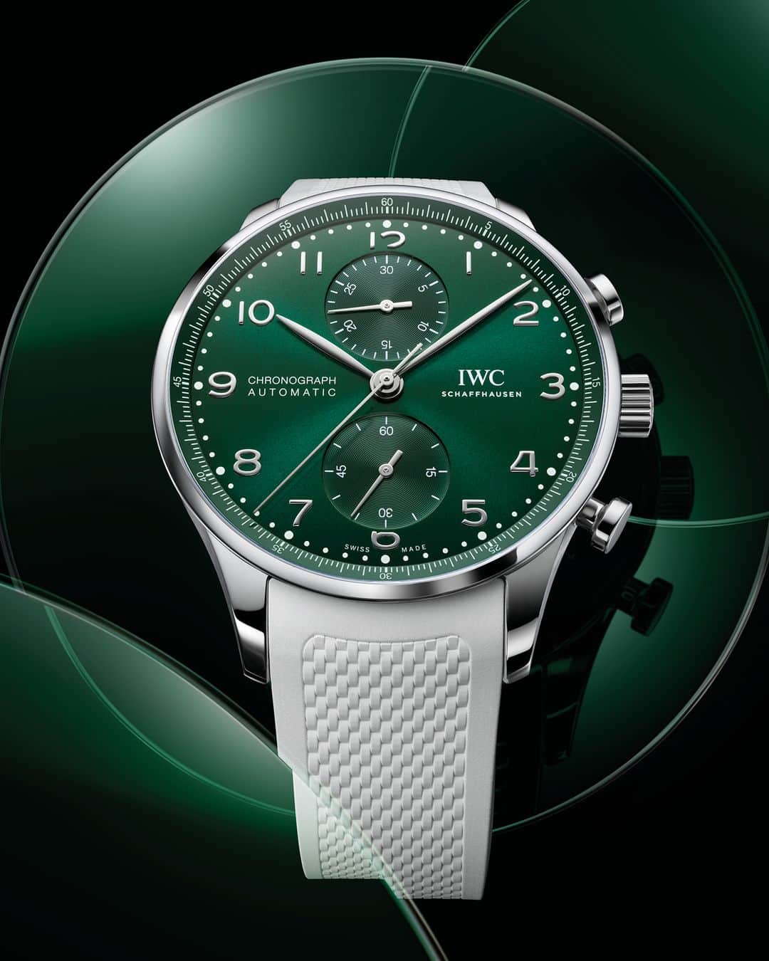 IWCのインスタグラム：「A deep green sunburst dial combined with a textured white rubber strap, the rhodium-plated hands and appliqués bring the final light touch to this bold and fresh new look.  #IWCportugieser | #TheReference  🔗Link in Bio  ℹ Green dial Stainless steel case 41mm IWC-manufactured 69355 Calibre Ref. IW371615 - Visit your IWC boutique or retailer to discover the variety of strap options available.」