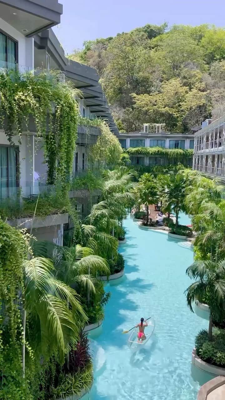 BEAUTIFUL HOTELSのインスタグラム：「Hold on tight as @emily_gomberg takes you on a magical journey through the crystal-clear waters of Panwaburi Beachfront Resort’s long swimming pool in Phuket, Thailand! 🚣‍♀️  Experience the perfect blend of land, sea, and sky as you navigate this unique and exhilarating adventure. ✨ The resort’s high level of personal service and attention to detail make it truly “Special.” 💦  Can you imagine yourself gliding through this incredible pool? Tag your travel buddy who would love this aquatic escapade! 🌴  📽 @emily_gomberg 📍 @panwaburibeachfrontresort, Phuket, Thailand 🎶 Ellie Goulding - Lights」