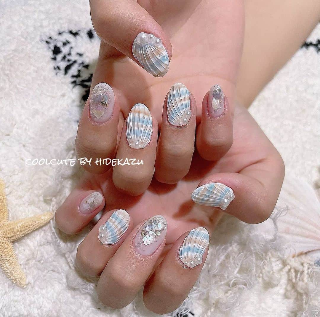 _hidekazu_さんのインスタグラム写真 - (_hidekazu_Instagram)「◇貝殻ネイル 夏のビーチスタイル🌊🐚  @raygel.nail_official   ネイル、レッスンのご予約お問い合わせはこちらから⬇️ プライベートサロンCoolCute 中目黒駅徒歩２分  ご予約はLINEより LINE 🆔→「@ghu9662h」 ※＠マークをつけたままご検索ください。  もしくはプロフィールの「メール」よりお問い合わせください。 ・ ・ ・ #ファッション#オシャレ#かわいい#かっこかわいい#coolcute#hidekazu#ネイルアート#ネイル#ジェルネイル#ネイルデザイン#レイジェル#ビューティガレージ#貝殻ネイル#ビーチネイル#リゾートネイル#夏ネイル#シェルネイル #nail#nails#nailart#nailartist#gelnail#beachnail#shellnails#beachnails」7月13日 20時10分 - _hidekazu_