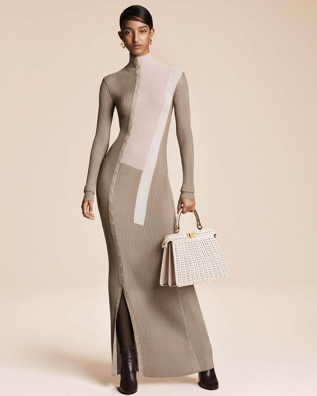 Fendiのインスタグラム：「Graphic motifs from Fendi Fall/Winter 1996 are expressed in intarsia in the #FendiFW23 campaign while the Maison's mastery of materials shines in iterations of the iconic #FendiPeekaboo.  Artistic Director of Couture and Womenswear: @mrkimjones​ Artistic Director of Accessories and Menswear: @silviaventurinifendi ​ Artistic Director of Jewellery: @delfinadelettrez​  Creative Direction: @ronnie.cooke.newhouse @karlbolander  Photography: @craigmcdeanstudio  Styling: @themelanieward Hair: @anthonyturnerhair Makeup: @peterphilipsmakeup  Casting: @shelleydurkancasting Set Design: @alexanderbockstudio  Model: @mona_tougaard」