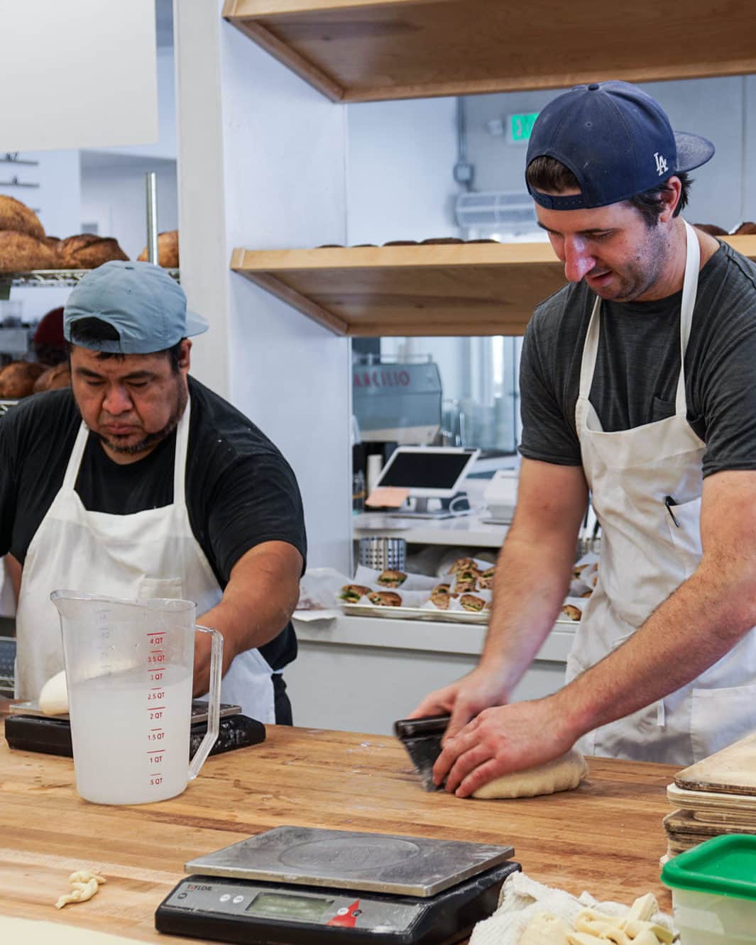 Eater LAさんのインスタグラム写真 - (Eater LAInstagram)「The day before its grand opening on July 13, Garrett McPerry shapes sourdough loaves with his head baker while his wife and partner Lauren Rosen coaches front-of-house staff on customer service. The lines are already stacking at Tommy & Atticus (@tommyandatticus), McPerry and Rosen’s yearslong journey to opening a full-fledged bakery in the South Bay, and the early results are already spectacular. Local dog walkers, curious passersby, and family friends are stoked with McPerry’s pastry case, chock-full of seasonal stone fruit and berry galettes, buttery croissants, crumbly cookies, and sugary kouign amann.  Click on the link in bio to read the opening of one of LA's best new bakeries, written by Eater LA lead editor Matthew Kang (@mattatouille).  📸: @mattatouille」7月15日 6時01分 - eater_la