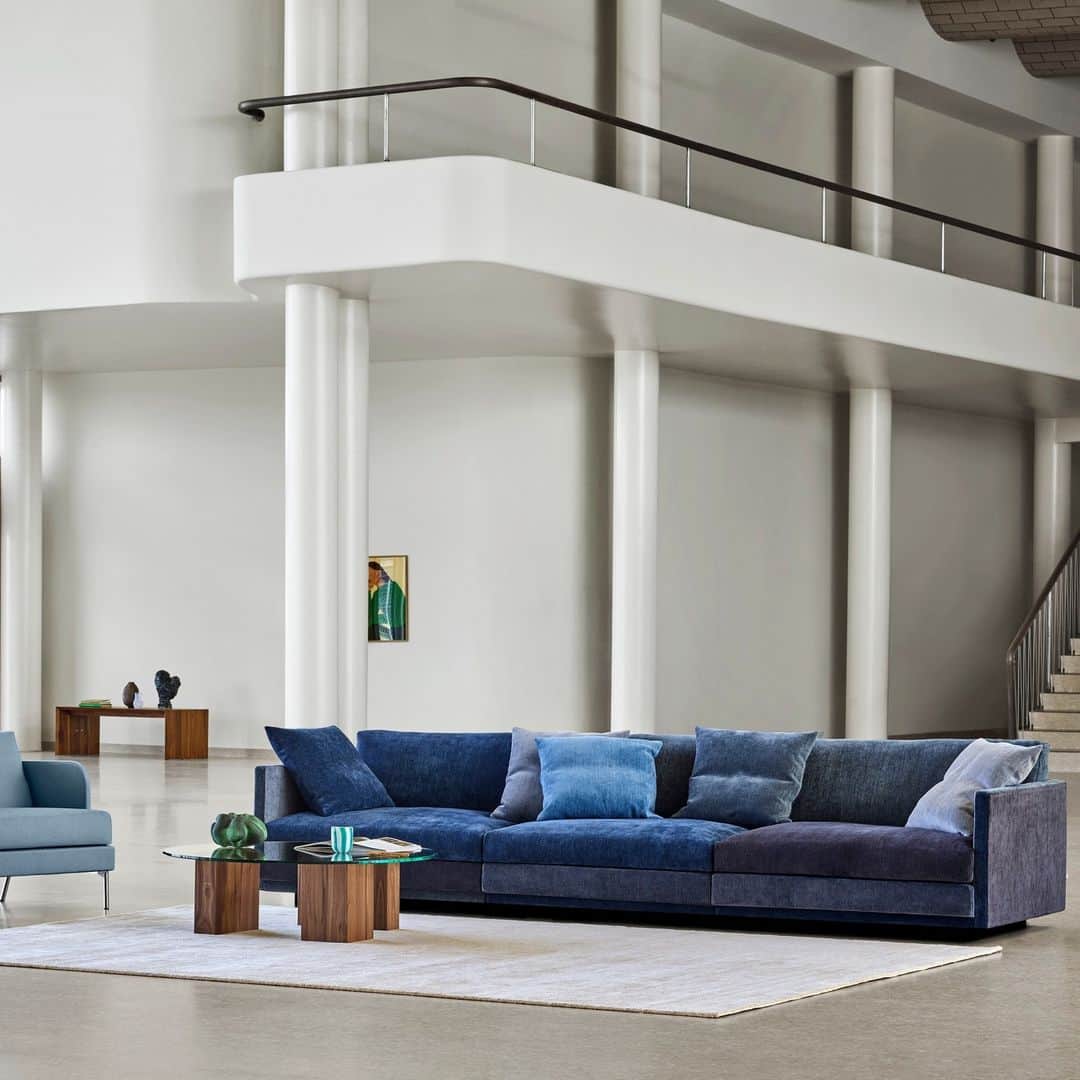 eilersenのインスタグラム：「Great Ash in the new multicolour Blues. The sofa is designed by Jens Juul Eilersen.⁠ ⁠ Great Ash urges well-being and comfort with its supporting back, elegant, sleek armrests, large cushions with down filling, and Eilersen’s famous down top.⁠ ⁠ Sofa: Great Ash Blues⁠ Table: Puzz with glass table top⁠ Side table: Kant in walnut⁠ ⁠ ⁠ ⁠ ⁠ #eilersen #eilersenfurniture #myeilersen #enjoyaneilersen #greatash #jensjuuleilersen #funen #pierresindre #homedecor #sofa #danishdesign #inredning #finahem #interiorlovers #interiordesign #modernliving #minimalism #nordiskehjem #nordicinspiration #nordicliving #craftsmanship #boligindretning #designinterior #livingroominspo #boliginspiration  #hemindredning #schönerwohnen #nordicminimalism #designinspiration #throughgenerations」