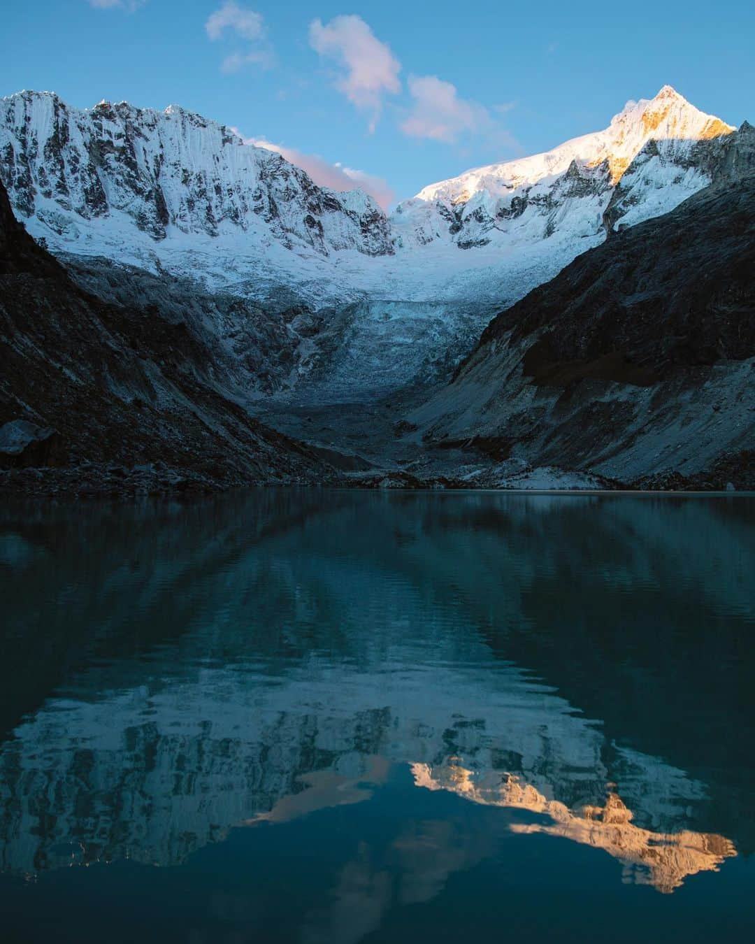 Alex Strohlのインスタグラム：「In a remote Peruvian Valley, waiting for the sun to set, listening to the glacier collapsing. It always comes down to interpretation, I could be sad because the glacier is melting away, or happy because it’s a really nice sunset.. I can’t remember the mood that day but I know that @isaacsjohnston and I weren’t mad about being up there!」