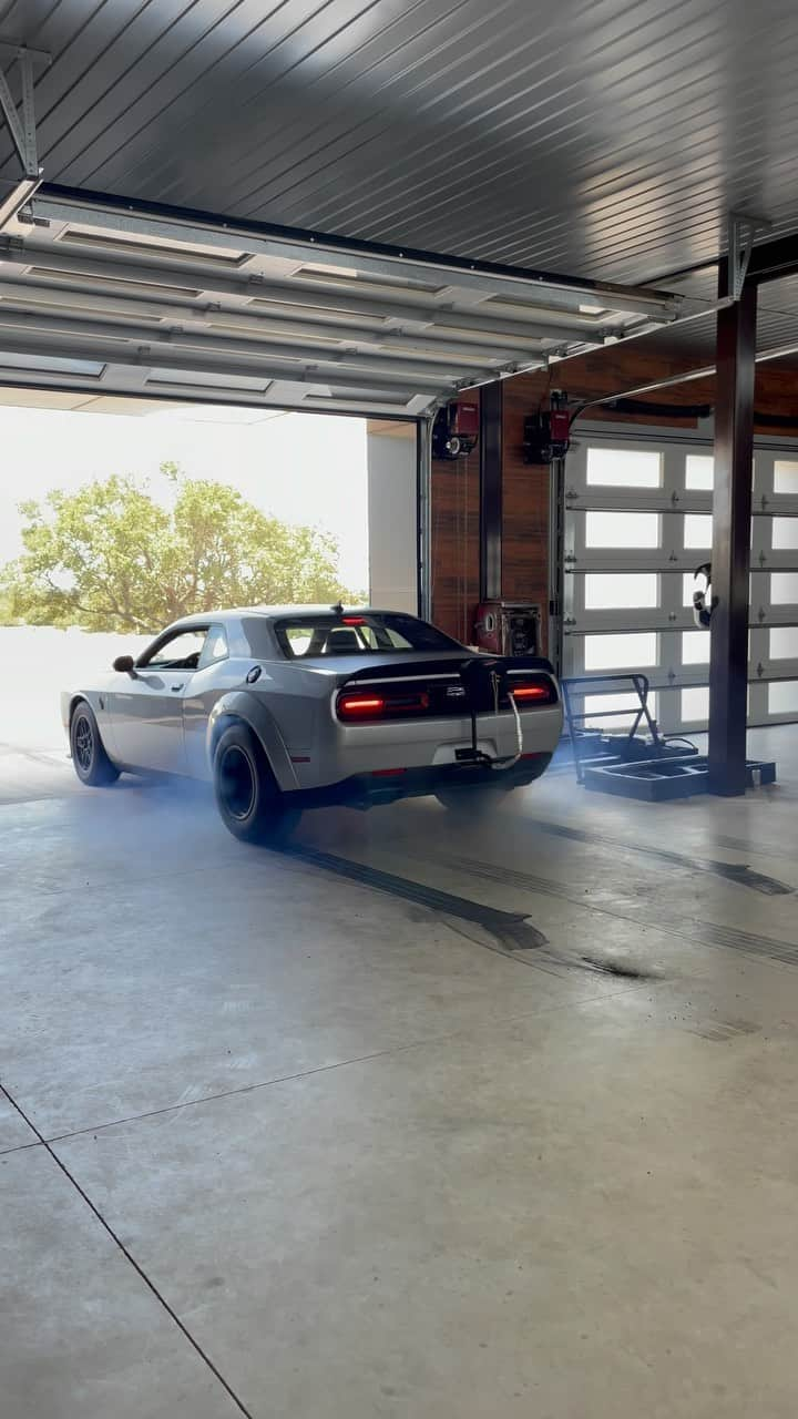 ビル・ゴールドバーグのインスタグラム：「Why???????? Why not!!! Just decorating my garage floor with the #demon170 ****CLICK YOUTUBE LINK IN BIO FOR COMPLETE TIRE DEVASTATION!! 😬**** And don’t forget to hit the subscribe button !!!!!! #burnout #garagemahal #garagesofinstagram #spear #jackhammer #whosnext #roadkillnights 😳 #horsepower #hemi #supercharged」