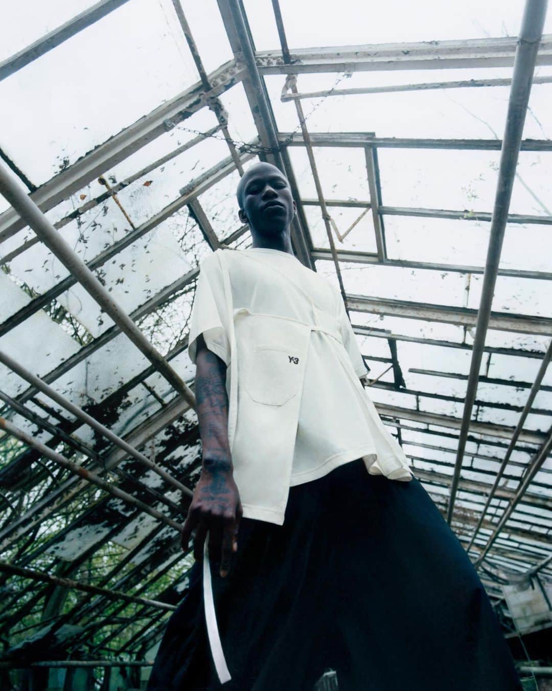 ワイスリーのインスタグラム：「@l.a.timpa​  LA Timpa is a self-taught musician, passionate about mental and physical issues among Black individuals and immigrant communities. His music often explores themes of love, isolation, mortality and religion. ​  Chapter 3, FW23​  Photographer: @1engua, Blankenfelde, Berlin, 2023.​  #adidas #Y3 #YohjiYamamoto」