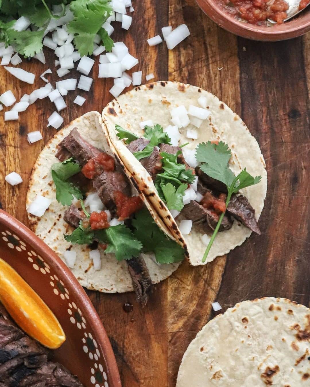 Food Republicのインスタグラム：「Citrusy Carne Asada Recipe  This recipe for carne asada celebrates the art of grilling flank steak to perfection, creating a delicious dish that embodies the essence of Mexican culture.  Recipe developed in collaboration with @taylorelysemurray.  Prep Time: 12 hours 5 minutes  Cook Time: 15 minutes  Servings: 2  Ingredients  For the carne asada:  -2 tablespoons white vinegar -1 tablespoon vegetable oil -1 orange, juiced -2 limes, juiced -½ white onion, thinly sliced -3 cloves garlic, thinly sliced -1 jalapeño, halved and seeded -¾ pounds flank steak -Salt and pepper  For the tacos:  -Tortillas -1 bunch cilantro, chopped -1 onion, chopped -Salsa, for serving  Directions  1. Combine the vinegar, oil, citrus juices, onions, garlic, and jalapeño in a bowl. 2. Place the flank steak in a ziplock bag and add the marinade. Seal tightly. Refrigerate overnight (or up to 24 hours). 3. Preheat a charcoal or gas grill to medium heat. 4. Remove the steak from the ziplock bag and discard the marinade. Season the steak generously with salt and pepper on both sides. 5. Place the steak on the preheated grill and cook for about 4-5 minutes per side for medium-rare, or adjust the cooking time to your desired level of doneness. 6. While grilling the steak, lightly grill the tortillas by placing them directly on the grill for a few seconds on each side until slightly charred. 7. Once the steak is cooked to your liking, remove it from the grill and let it rest. Slice the grilled steak against the grain into thin strips. 8. To assemble the carne asada tacos, place a few slices of grilled steak onto each warmed tortilla. Top with chopped cilantro, chopped onions, and a spoonful of salsa. 9. Serve the tacos immediately and enjoy your delicious homemade carne asada.」