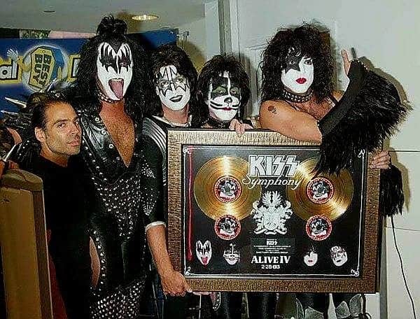 KISSのインスタグラム：「#KISSTORY - July 23, 2003 - We received Gold awards for the KISS Symphony - Alive IV album during an in-store at the NYC Best Buy. #KISS50」