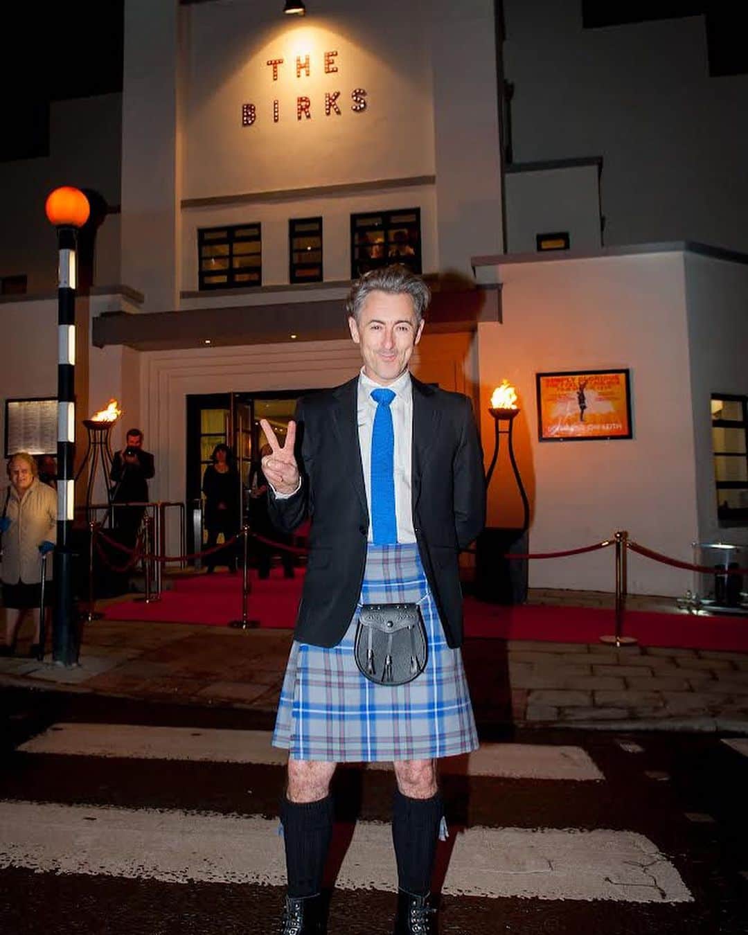 アラン・カミングのインスタグラム：「Did you know I'm the patron of The Birks Cinema in Aberfeldy in Scotland, the town of my birth?! Well I am, and here are some pics of me at the gala opening ten years ago! It’s one of those magical stories where a beautiful old former picture house that had variously been a bingo hall and an amusement arcade and finally just abandoned was brought back to life by a team of staunch locals and it revitalised the local community through the magic of both cinema and having somewhere to go for a wee cuppa and a natter.  Of course,  as we all know, cinemas, particularly independent cinemas like the Birks, have struggled to stay afloat in recent years what with the challenges caused by Covid-19, the cost of living crisis, and other factors. Sadly, the future of this cherished community hub and cinema is under threat. In an effort to help safeguard the future of The Birks, I have sponsored a seat in the auditorium and I hope you might join me or else show your support for this amazing community-owned cinema in your own way by going to @birkscinema and clicking on the donation page in their bio.  Or, if you happen to find yourself in the area, why not pop in for a movie or two, or a snack in their cafe? Your support will help sustain the cinema's cultural and community activities and events, which have become the lifeblood of Aberfeldy and the surrounding areas in Perthshire. Every contribution, no matter the size, will make a vital difference.」