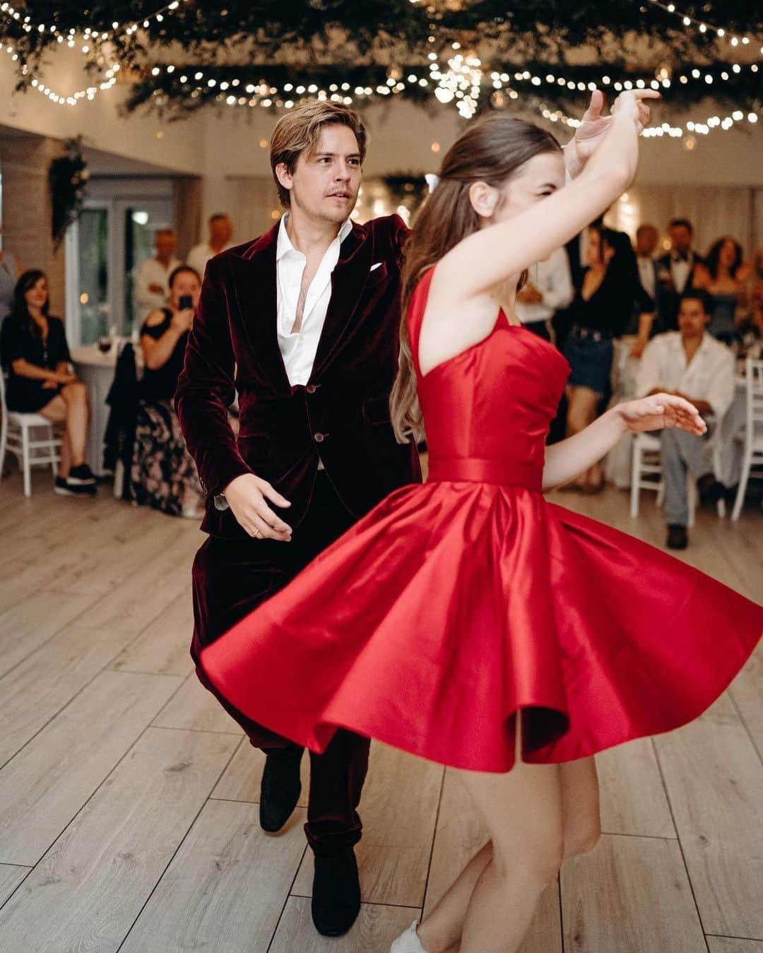 カナーリのインスタグラム：「@dylansprouse celebrates his wedding with @realbarbarapalvin in Hungary wearing a red velvet blazer with peak lapels and fold-over pockets paired with matching straight leg trousers by Canali. Photo by @eszterle Styled by @marc_eram  #Canali1934」