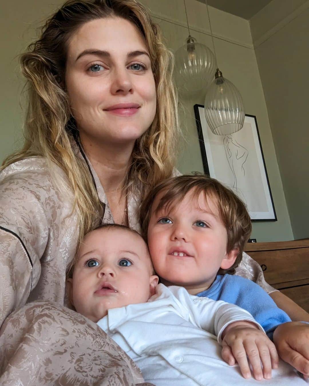 Ashley Jamesさんのインスタグラム写真 - (Ashley JamesInstagram)「This is what happiness looks like for me at the moment.   I was thinking today that when I had those 6 years of being single I did some amazing things: travelled the world, DJed, saw my friends all the time. It was the best experience. But in the times I wasn't travelling, I'd find it really hard to be happy if my feet were on the ground and I was at home.   I remember I'd wake up in the morning and it was just me, and as I'd rarely be messaging anyone, it would be normal for me to wake up and not have anyone say good morning.  I remember thinking how many people took that simple thing for granted. That - and having someone to unzip your dress at the end of the night.  I remember thinking that one day someone would be there to say good morning and it was worth holding out for that right person.  Well recently, I wake up to the sound of Alf - who for the most part wakes up around 6:30 / 7 for the first time in forever. And he comes into our room saying 'good morning mummy. Wakey wakey Ada!'   And he wants to cuddle. Today he asked if Ada could sit on him and as a special treat we watched miss Rachel on the TV.   And I thought - this right here - no makeup and messy hair - this is true happiness. I'm so grateful 🥲  And honestly, I have shared this before but in the low days when I mourned my old life and used to Google things like 'is it normal to regret Motherhood' rather than people telling me how much worse it would get ("you think this is bad! Wait until..."). I wish someone had just said, it's ok. It is hard. And it's normal to miss your life and find life monotonous - but one day those babies turn into people with personalities - who sleep! - and they're actually pretty fun. And you get to do lots of the old stuff but with the added bonus of all the amazing new stuff too. And you get to see your heart walking around every single day.   And I know it will only get better and better.  Mornings are now my favourite time of the day. And I don't have to chase happiness anymore, because it's right here: at home. 🤍✨   (Although side note I am very excited for the day that I can see friends more. But this chapter: I call mum era. The last time I have a baby.) 💙」7月27日 4時01分 - ashleylouisejames