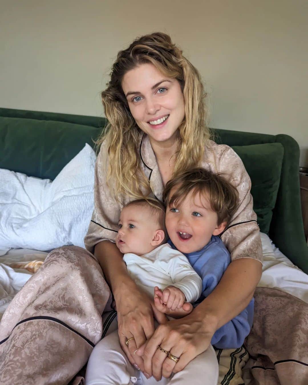 Ashley Jamesさんのインスタグラム写真 - (Ashley JamesInstagram)「This is what happiness looks like for me at the moment.   I was thinking today that when I had those 6 years of being single I did some amazing things: travelled the world, DJed, saw my friends all the time. It was the best experience. But in the times I wasn't travelling, I'd find it really hard to be happy if my feet were on the ground and I was at home.   I remember I'd wake up in the morning and it was just me, and as I'd rarely be messaging anyone, it would be normal for me to wake up and not have anyone say good morning.  I remember thinking how many people took that simple thing for granted. That - and having someone to unzip your dress at the end of the night.  I remember thinking that one day someone would be there to say good morning and it was worth holding out for that right person.  Well recently, I wake up to the sound of Alf - who for the most part wakes up around 6:30 / 7 for the first time in forever. And he comes into our room saying 'good morning mummy. Wakey wakey Ada!'   And he wants to cuddle. Today he asked if Ada could sit on him and as a special treat we watched miss Rachel on the TV.   And I thought - this right here - no makeup and messy hair - this is true happiness. I'm so grateful 🥲  And honestly, I have shared this before but in the low days when I mourned my old life and used to Google things like 'is it normal to regret Motherhood' rather than people telling me how much worse it would get ("you think this is bad! Wait until..."). I wish someone had just said, it's ok. It is hard. And it's normal to miss your life and find life monotonous - but one day those babies turn into people with personalities - who sleep! - and they're actually pretty fun. And you get to do lots of the old stuff but with the added bonus of all the amazing new stuff too. And you get to see your heart walking around every single day.   And I know it will only get better and better.  Mornings are now my favourite time of the day. And I don't have to chase happiness anymore, because it's right here: at home. 🤍✨   (Although side note I am very excited for the day that I can see friends more. But this chapter: I call mum era. The last time I have a baby.) 💙」7月27日 4時01分 - ashleylouisejames