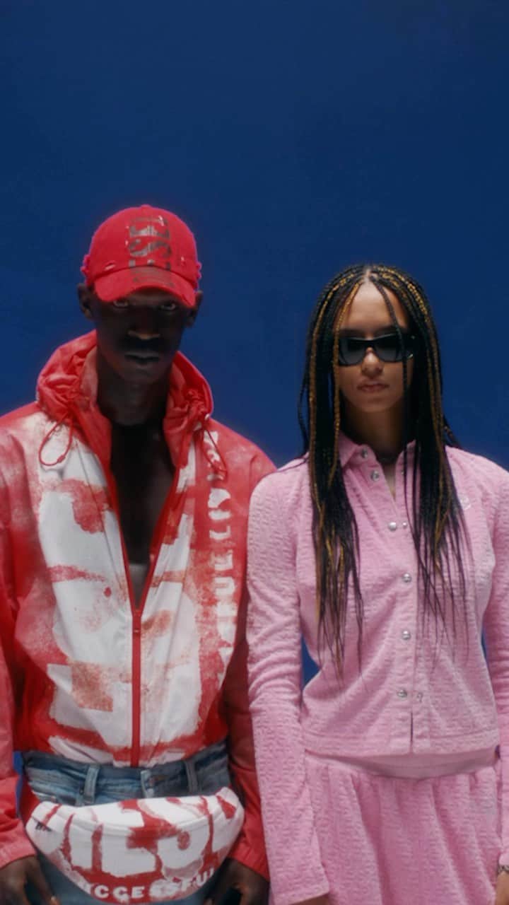 ディーゼルのインスタグラム：「D here. D there. D everywhere.   New interpretations of the Diesel Superlogo are applied like a stripe down the center of a cap, a windbreaker and a belt bag for men. A pink collared shirt and matching pants in soft pink all-over monogram create a new version of a track suit.    Shop at the link in bio.   #ForSuccessfulLiving #DieselFW23」