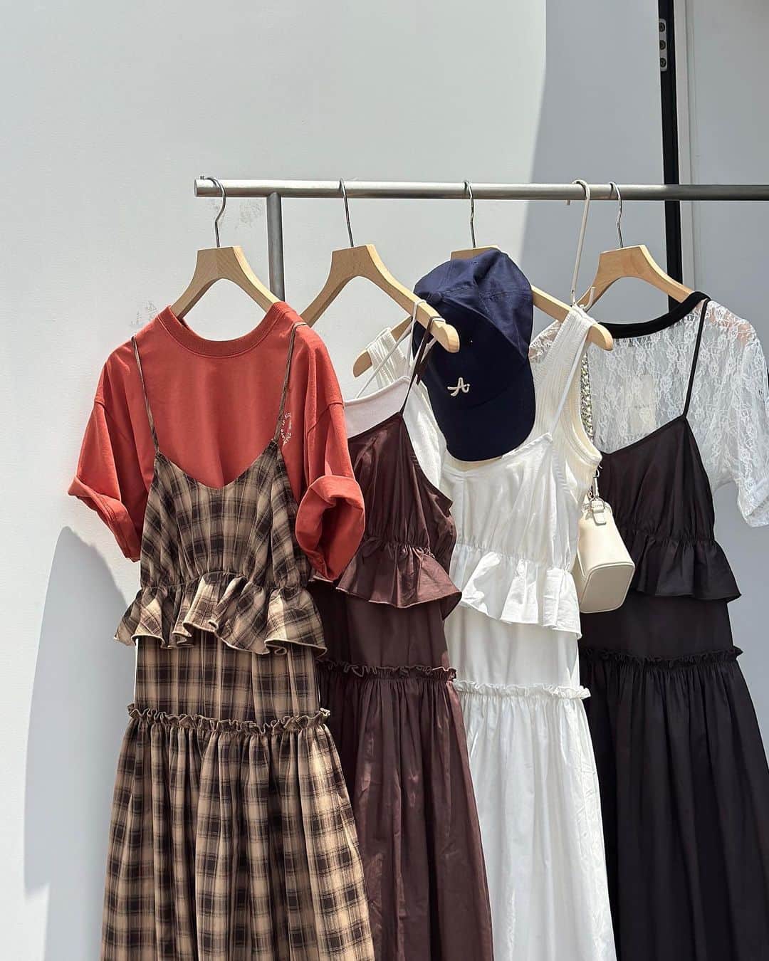 w closetのインスタグラム：「【new arrival】  "可愛いと思ったらいいね♡" _______________  フリルギャザーキャミワンピース ¥7,590 color : オフホワイト　ブラウン　スミクロ　キャメル/ブラウン  ウエストの切り替えがポイントのワンピース フリルをふんだんに使ったガーリーなデザインが可愛い♪  肩紐で長さの調節が可能◎ _______________  #wcloset#ダブルクローゼット#wclo_snap#リゾートコーデ#新作コーデ#夏トレンド#夏スタイル#サマーコーデ#トレンドアイテム#カラーコーディネート#スタイルアップコーデ#カラーアイテム#夏コーディネート#レイヤード#ワンピース #ワンピースコーデ#キャミワンピ#キャミワンピース#キャミワンピコーデ#チェックワンピ#チェックワンピース #ギンガムチェック#ギンガムチェック柄#ギンガムチェックワンピース #フリルワンピース #ティアードワンピース #ティアード#夏ワンピ#夏ワンピース#tシャツコーデ」