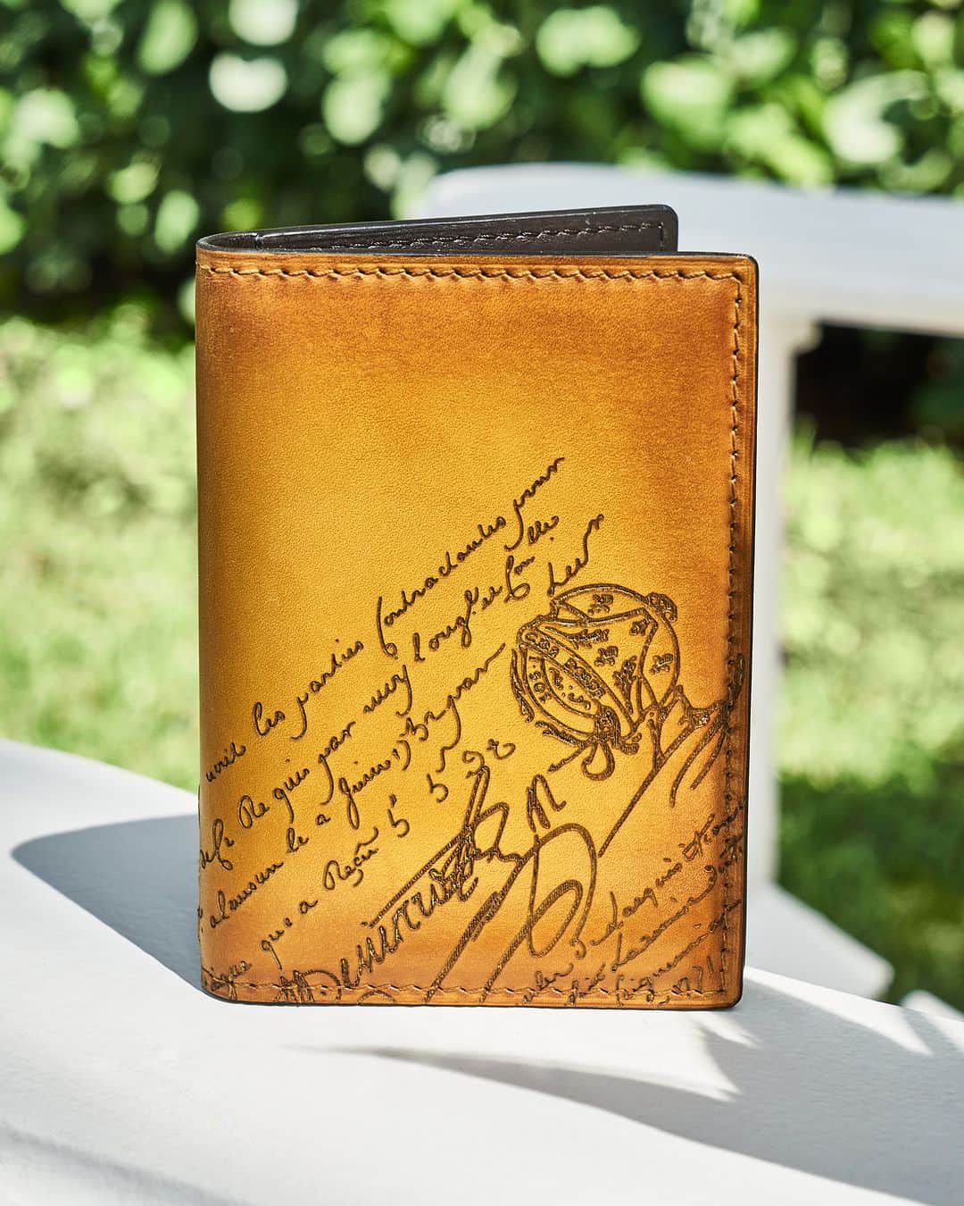 ベルルッティのインスタグラム：「- THE ACCESSORY: JAGUA BY #BERLUTI -   Taking on the new seasonal Mimosa patina in a luxurious yellow tone inspired by the honey-like fragrance of the winter bloom, Berluti’s emblematic Jagua wallet becomes the unexpected touch of colour to liven up any look.   Now available online and in-store.   Photography by @chauntevaughn   #BerlutiFall2023」