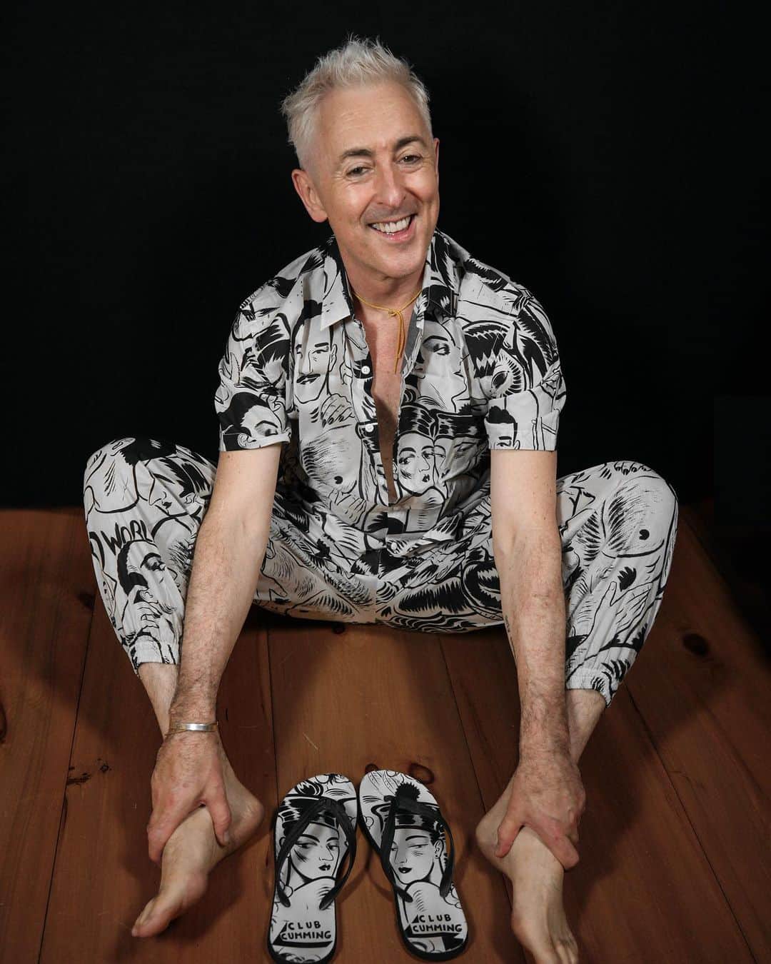 アラン・カミングのインスタグラム：「Club Cumming PJs are available again! This collaboration with our friends at @rocksoupnet , featuring the iconic CC mural painted by @granteepants , is available to pre-order now. And also check out our range of other merch like flip flops, T-shirts and hoodies too! All available at the @clubcumming store (link in bio)   Photos by @judithglue」
