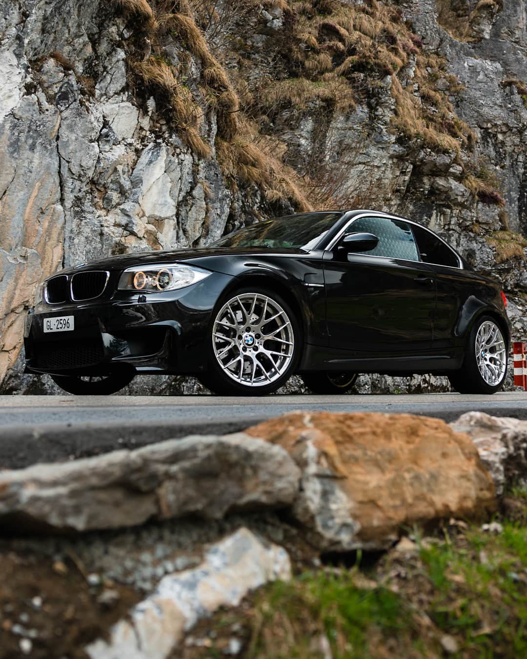 BMWのインスタグラム：「#BMWRepost 📸 @girlsgear @simon_hefti  Rocking the road ahead ⛰️  The 2012 BMW 1 Series M Coupé. #BMWClassic #BMW」