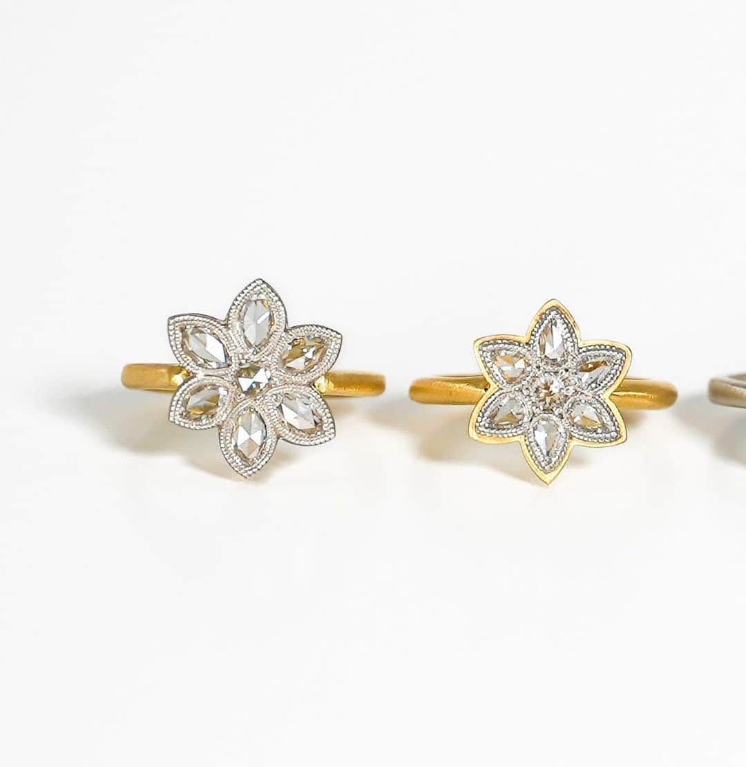 ハムのインスタグラム：「One Off 7diamonds オンライン販売開始  この個性的且つ親しみやすいモチーフには、とあるルールが隠されています。  パヴェセッティングというスタイルをご存知でしょうか。小さな宝石が敷き詰められた様を石畳に見立ててこう呼びます。 同じ大きさの石を無作為に並べるだけのように思えますが、その配置は必ず中心から始まります。7石をひとつの単位として、それを徐々に広げていくようにセッティングする決まりがあるのです。  規則的なパヴェセッティングの最小単位を抜き出してアレンジしたのが、このモチーフ。カットもシェイプも様々なダイヤモンドをデザイナーの感性で7つ組み合わせ、自社の職人によるハンドメイドで1点物に仕立てました。  隠された「7diamonds」のルールによって、不揃いなはずのダイヤモンドも不思議と落ち着いた表情を見せます。いびつで愛らしく、少しのユーモアが効いた大人のジュエリーです。     ※こちらの商品はhum JINGUMAE atelier & shopにてご覧いただけます。」