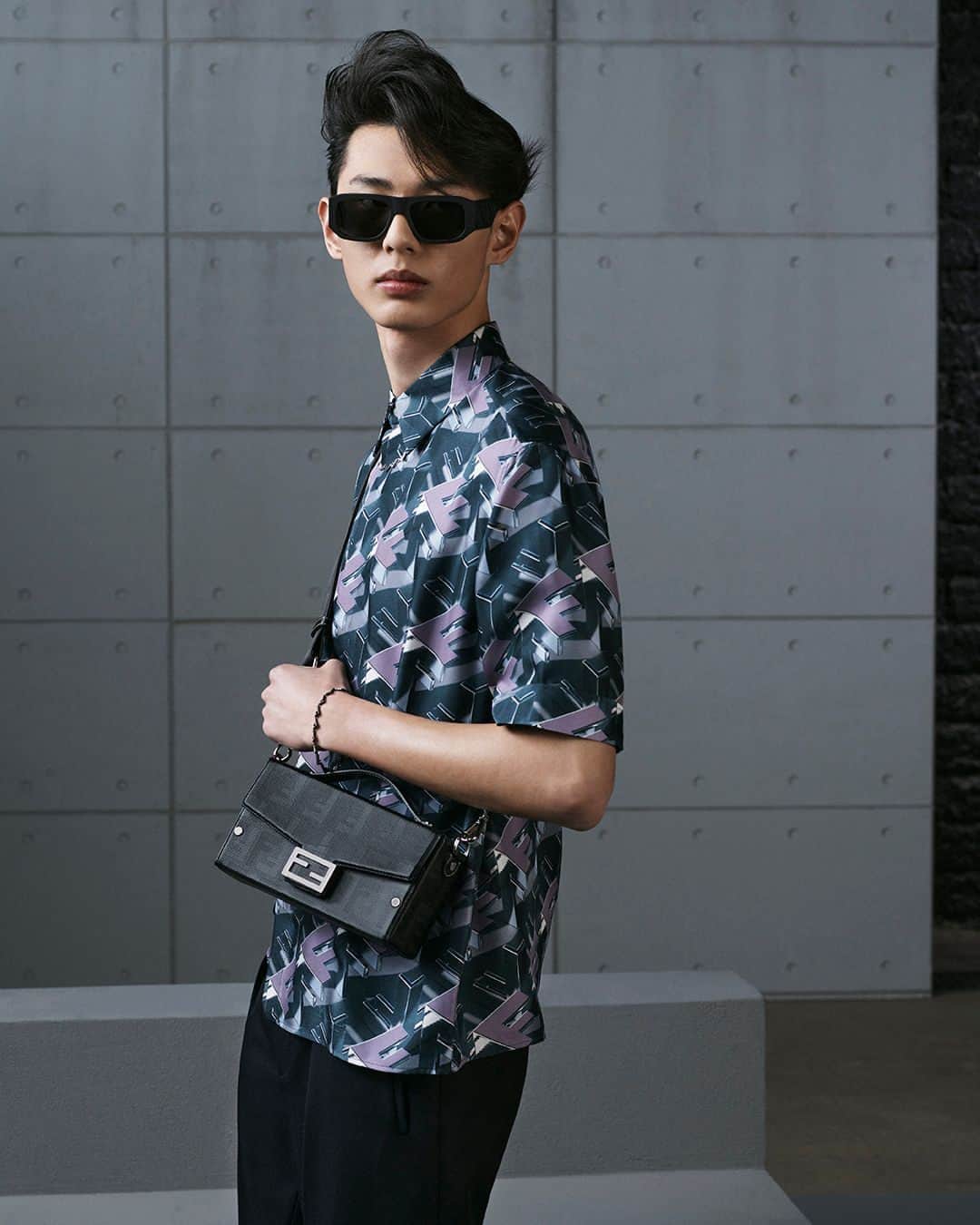 Fendiのインスタグラム：「Drawing inspiration from a heritage diagonal line pattern, new iterations of the iconic #FendiBaguette Soft Trunk feature the season's Fendi Shadow motif.⁣ ⁣ Artistic Director of Accessories and Menswear: @silviaventurinifendi⁣ Artistic Director of Jewellery: @delfinadelettrez​⁣ ⁣ Photography: @brunostaub ⁣ ⁣ Styling: @ganio⁣ Makeup: @samiamohsein⁣ Hair: @ramoneyluv⁣ ⁣ Casting: @piergiorgio⁣ ⁣ Model: Shaoqi Zeng」