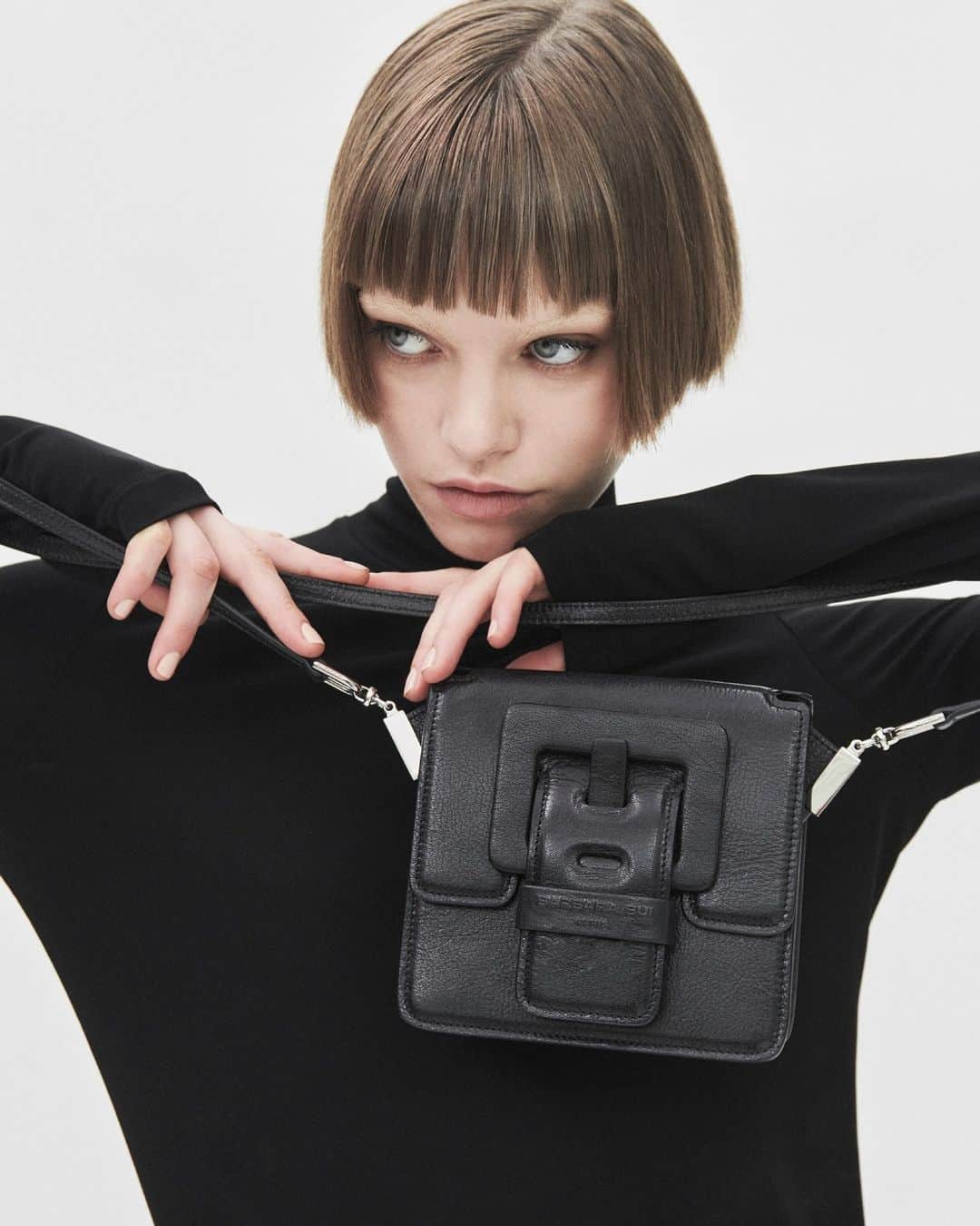 のインスタグラム：「An object of desire, the “LOVE ME" is the most miniature bag in the BARBARA BUI "ME" family. Highly architectural, its structure is like a small box, perfectly symmetrical. This little genderless secret bag, adopted by women and men alike, is one you simply cannot (and would not want to) go without.⁠ ⁠ Photos - C&S_P @stefano_p_o_l_i⁠ Model - @lise.sauve_⁠ Hair & Makeup - @flavioche⁠ ⁠ New collection, now online and in our stores !⁠ ⁠ #newco #leatherbag #crossbodybag #madeinitaly #frenchdesign #newcollection」